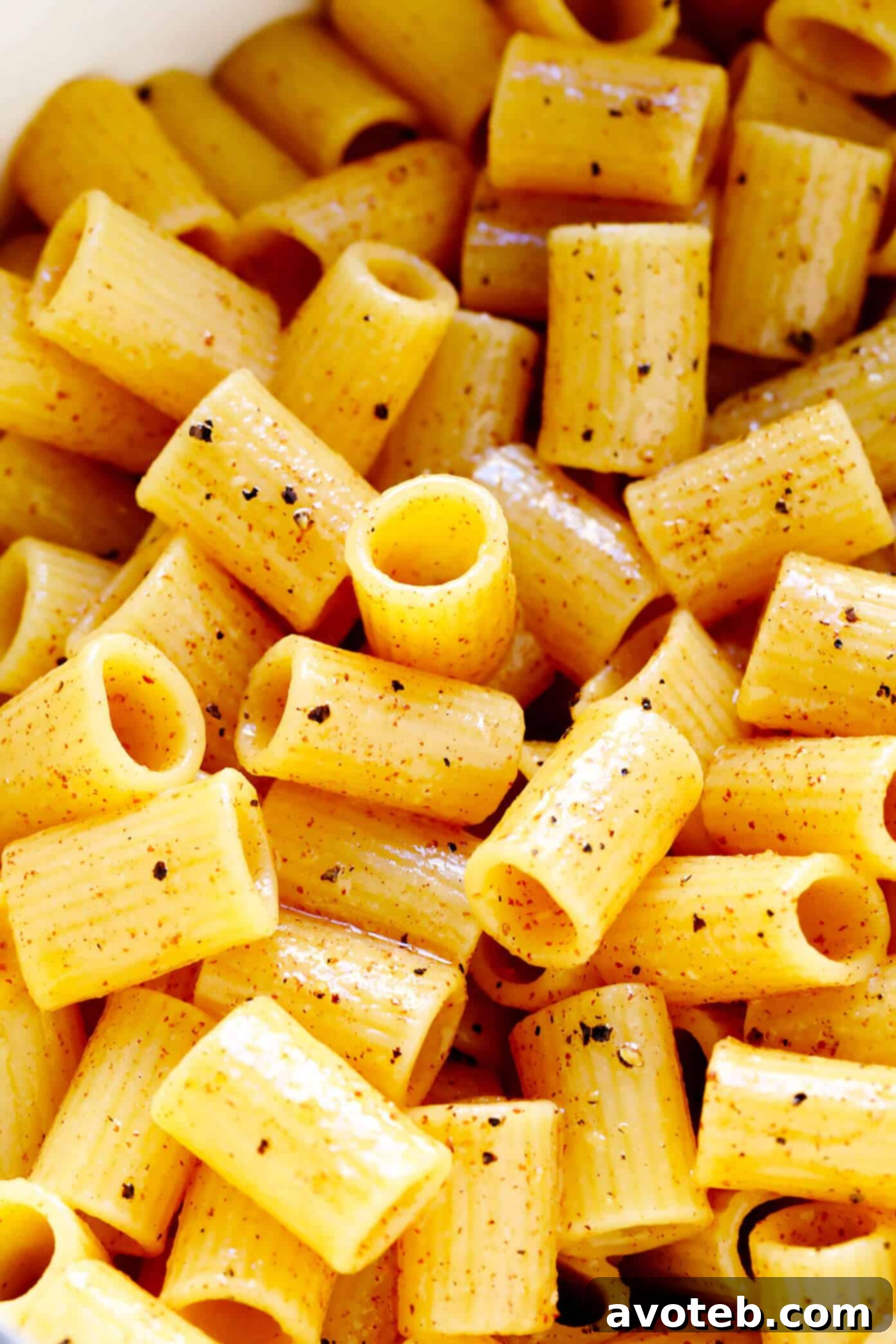 Closeup of the Brown Butter Lemon Pasta, showing the flecks of black pepper and lemon zest in the glossy sauce.