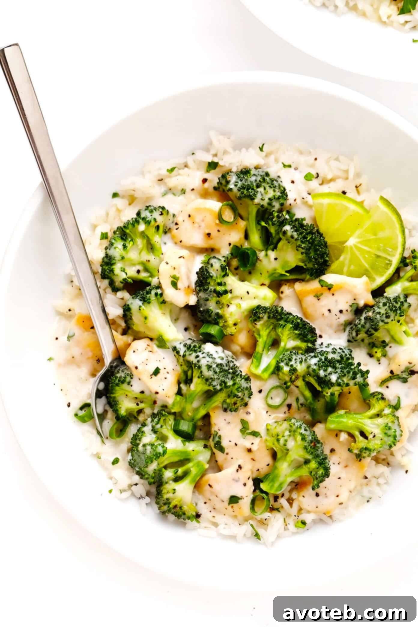 Serving bowl filled with Coconut Lime Broccoli Chicken and rice, garnished with fresh cilantro