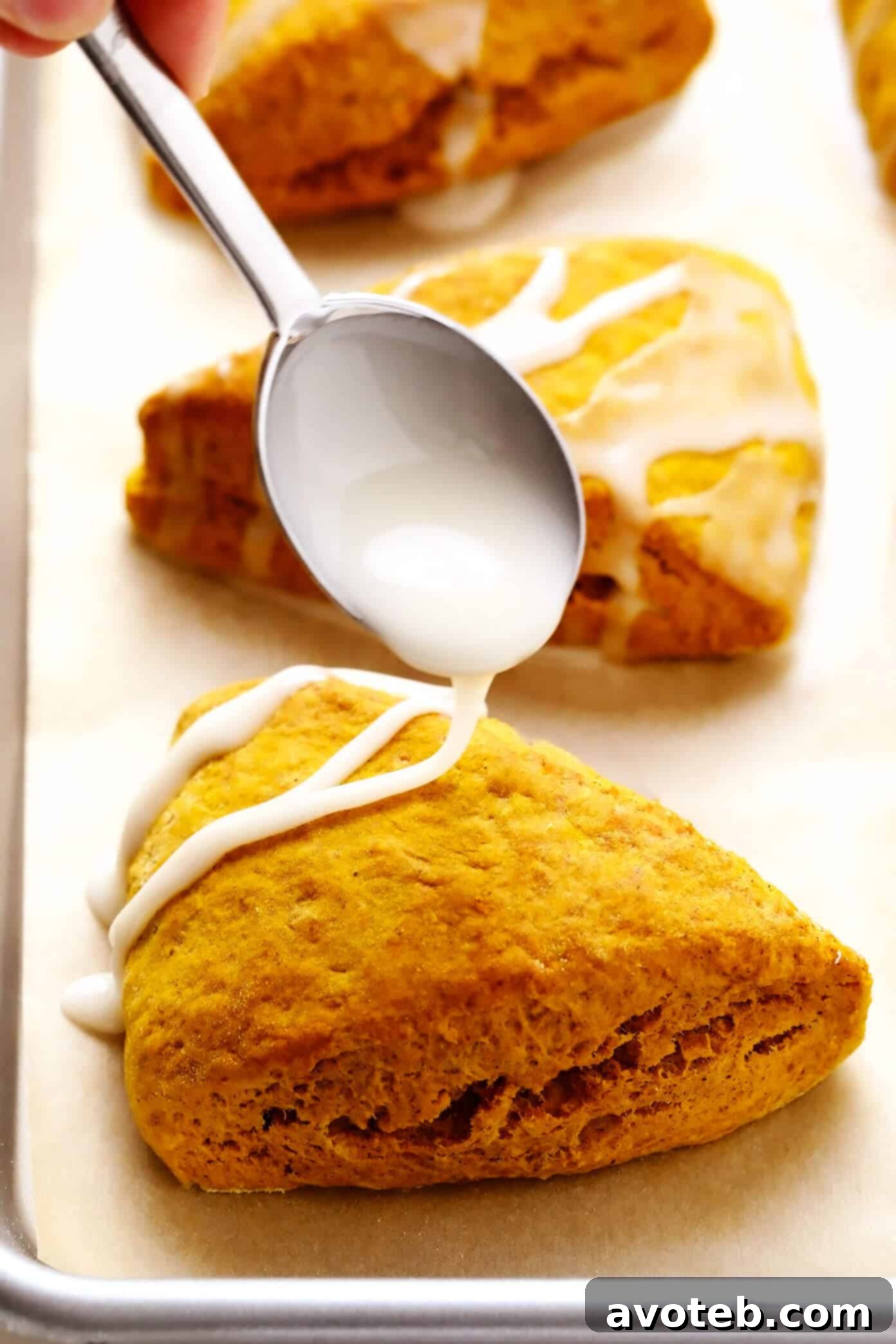 Drizzling Vanilla Glaze on Pumpkin Scones