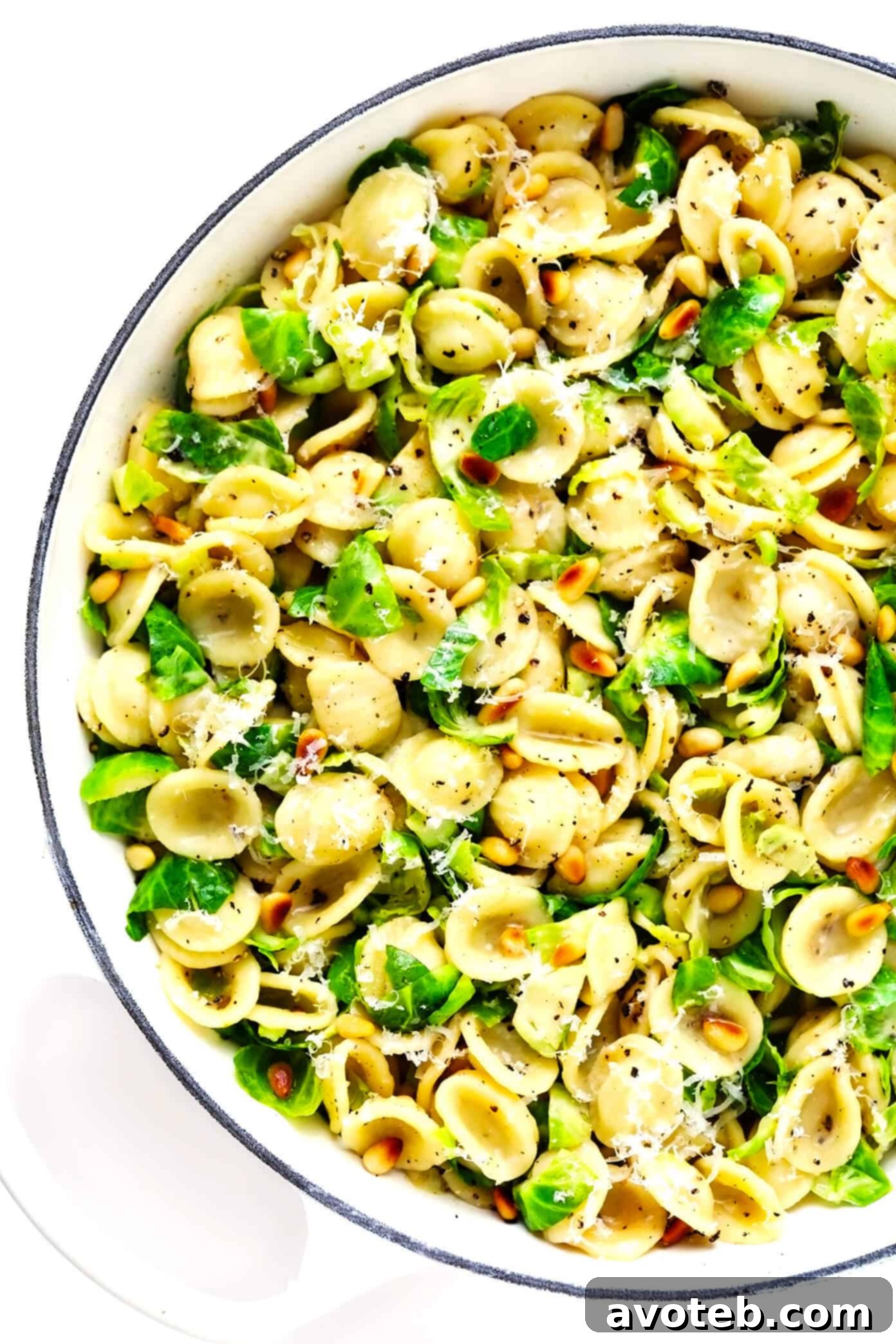 Brussels Sprouts Parmesan Pasta with Pine Nuts cooking in a sauté pan