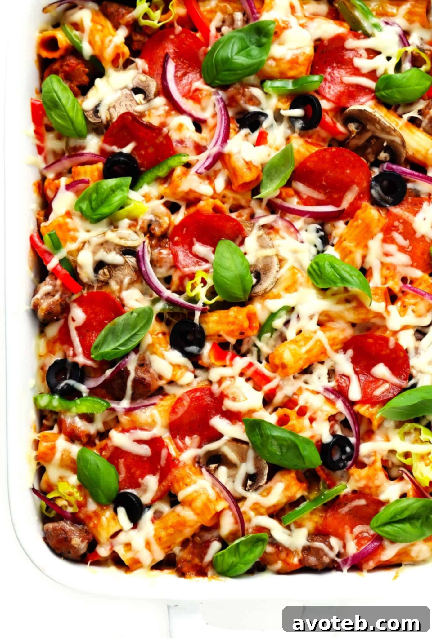 Pizza Baked Ziti in Baking Dish with Basil Garnish