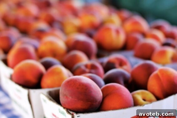 Sweet, juicy peaches for sale at the local farmer's market A vibrant display of freshly picked, ripe peaches at the City Market