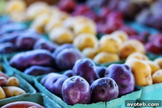 Variety of potatoes, from red to Yukon gold A colorful assortment of freshly harvested potatoes at a market stall