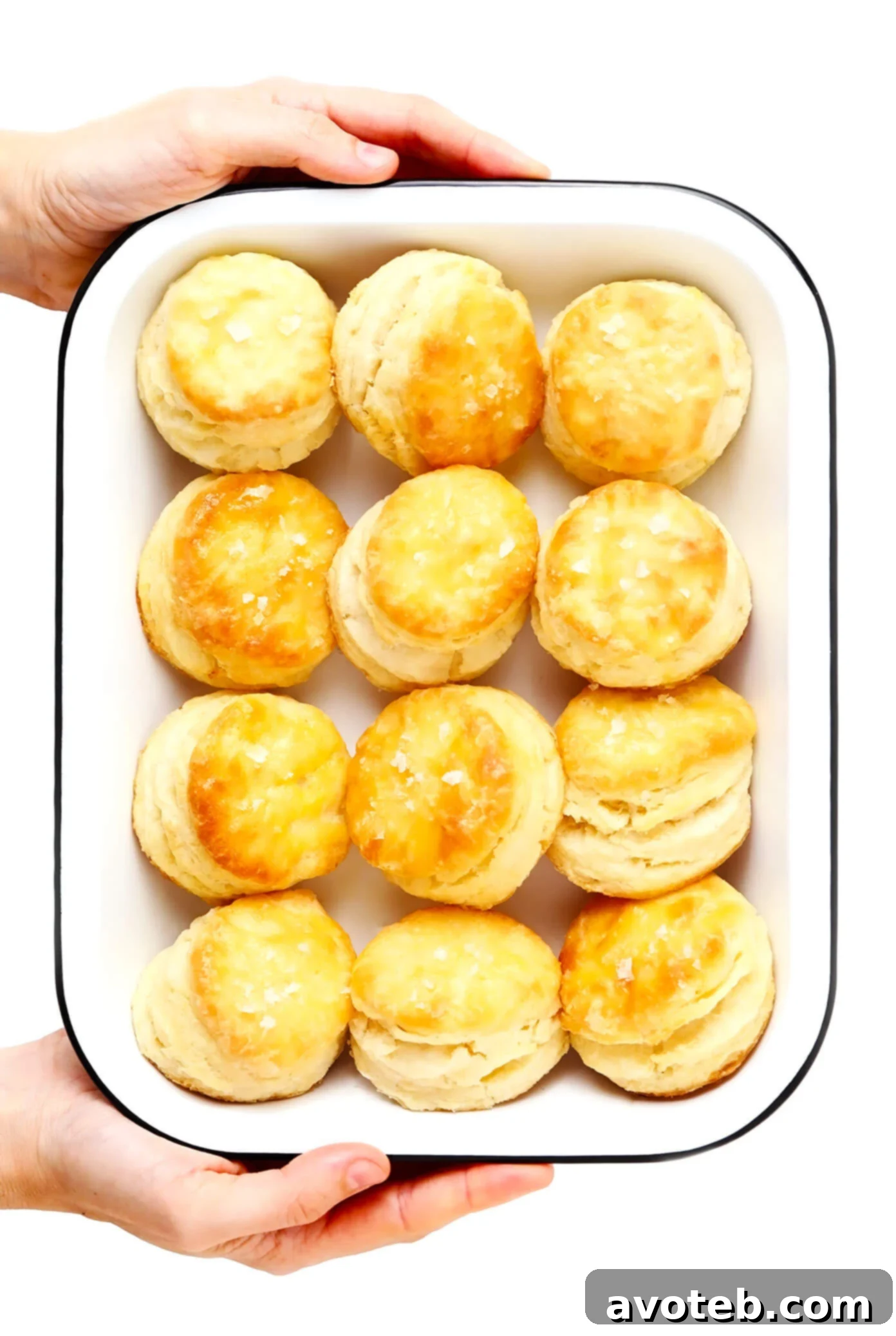 My favorite homemade buttermilk biscuit recipe -- easy to make, perfectly soft and tall and flaky, and always SO buttery and delicious. Serve them for breakfast with jam or gravy, as a side dish for lunch or dinner, or as a topping for chicken pot pie or your favorite casserole! | gimmesomeoven.com #biscuit #roll #bread #recipe #buttermilk #breakfast #brunch #side #vegetarian #baking A pan of freshly baked homemade biscuits, golden brown and ready to serve.
