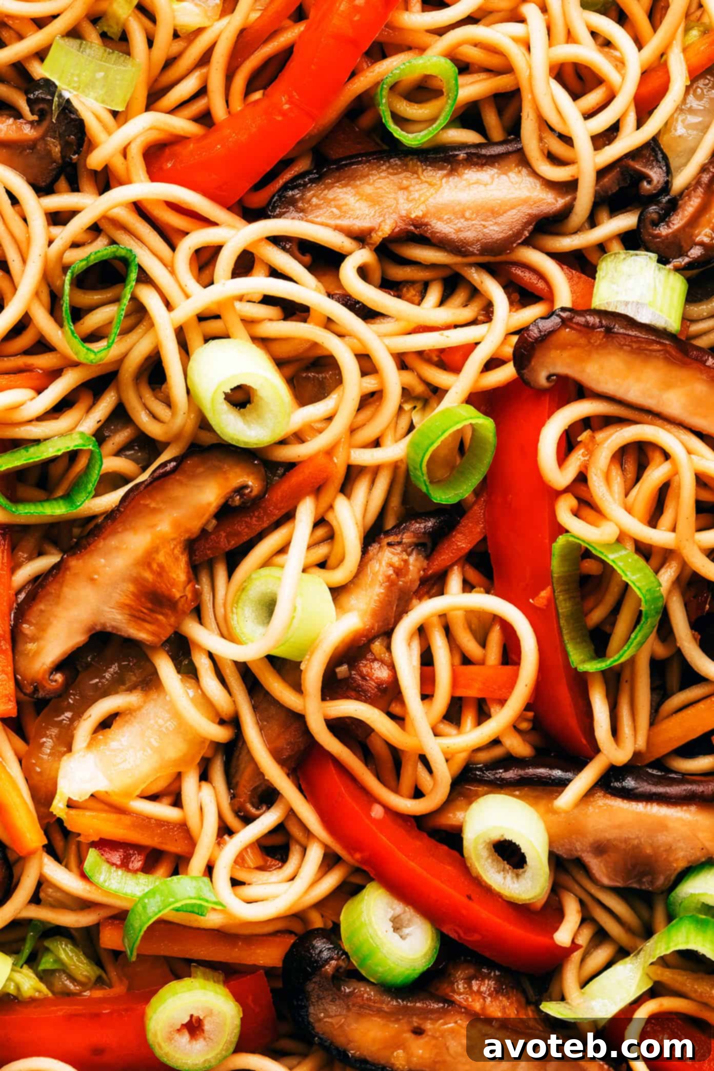This Chinese-inspired chow mein recipe is easy to whip up in just 25 minutes and tossed with a delicious stir-fry sauce. Feel free to add beef, chicken, pork, shrimp, tofu, or any other extra veggies you might like too! | gimmesomeoven.com Chow mein noodles closeup