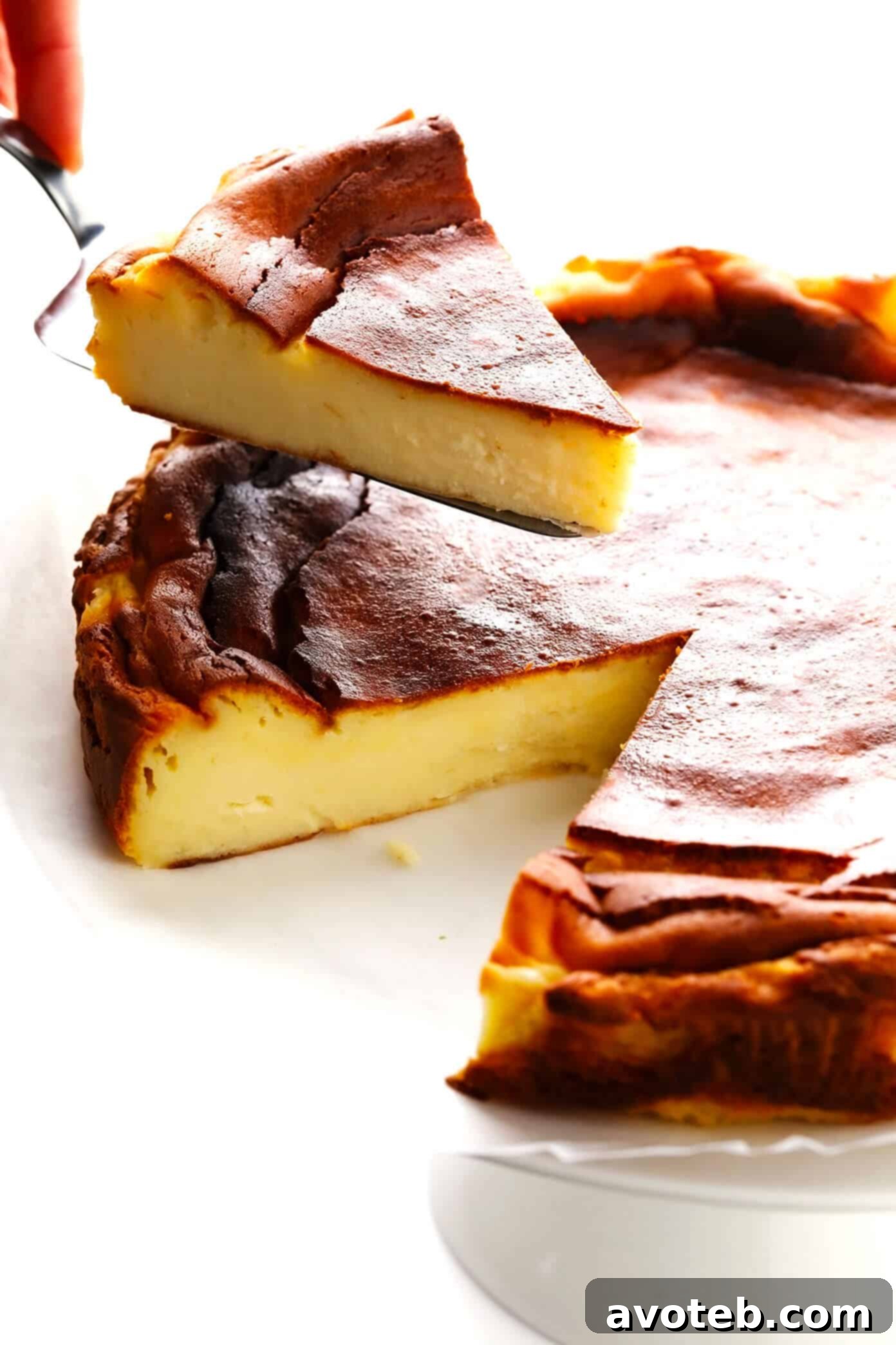 Slices of 'Burnt' Basque Cheesecake (Tarta de Queso La Viña style) served on a plate, highlighting the creamy interior and caramelized exterior.
