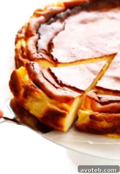 The iconic 'Burnt' Basque Cheesecake (Tarta de Queso) with its deep golden-brown, caramelized top, signifying its unique flavor and texture. This foolproof recipe is ideal for any dessert occasion.