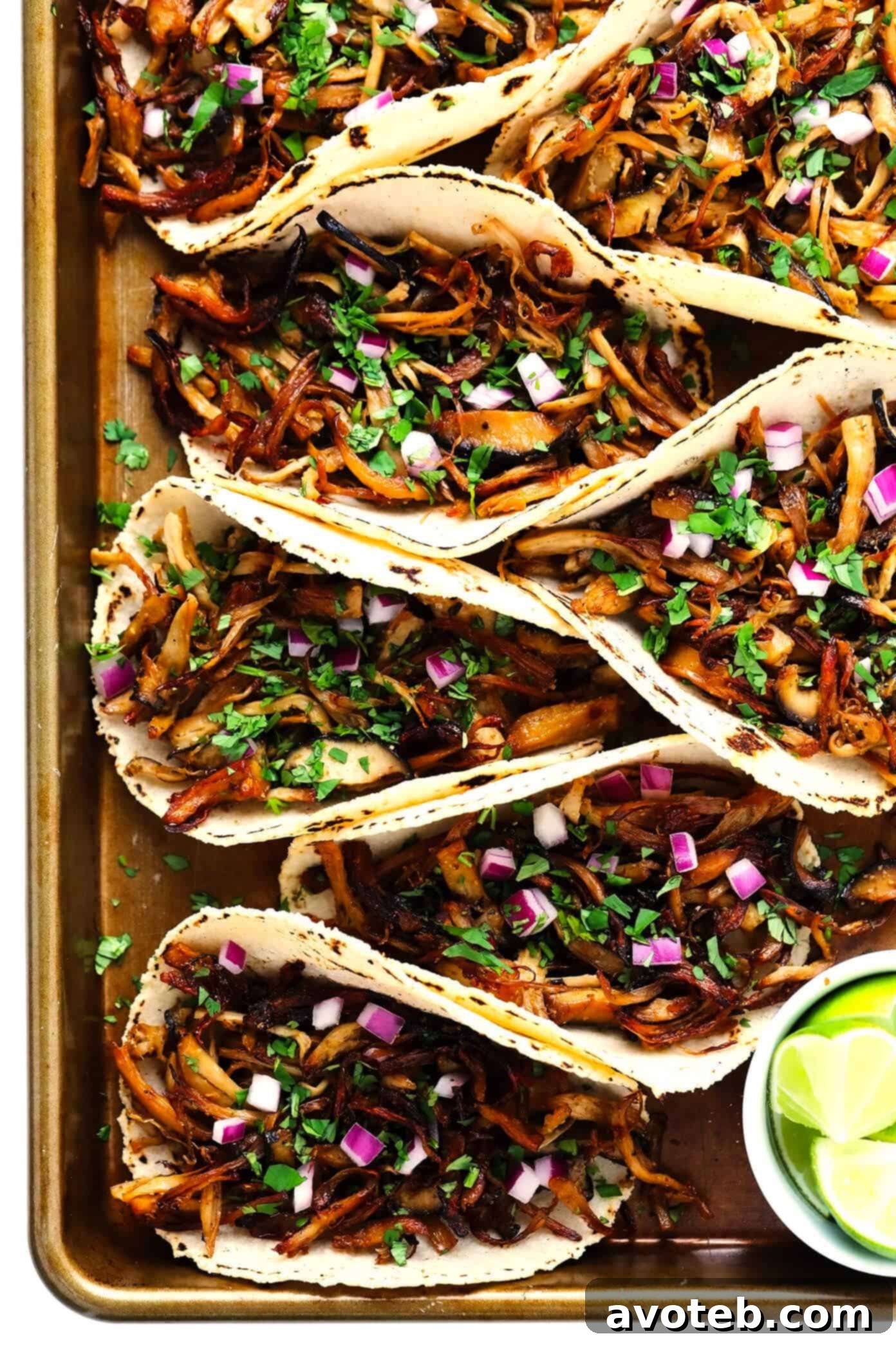 Mushroom Carnitas Tacos with limes and cilantro