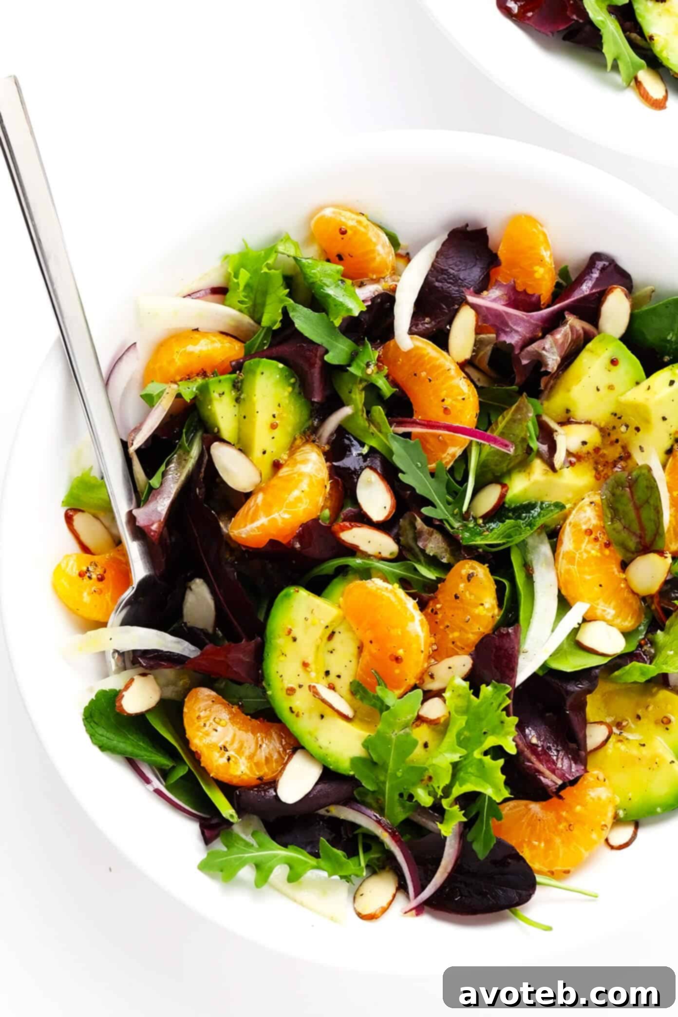 Orange, Fennel and Avocado Salad in a large serving bowl, garnished with almonds