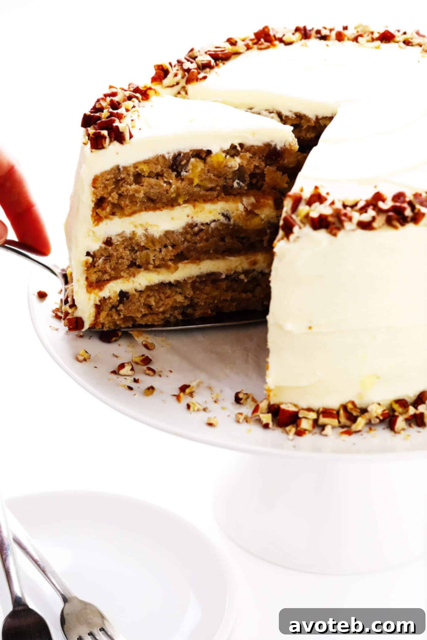 Cutting a slice of hummingbird cake