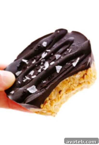 Salted Chocolate Peanut Butter Oat Cup with a bite taken out