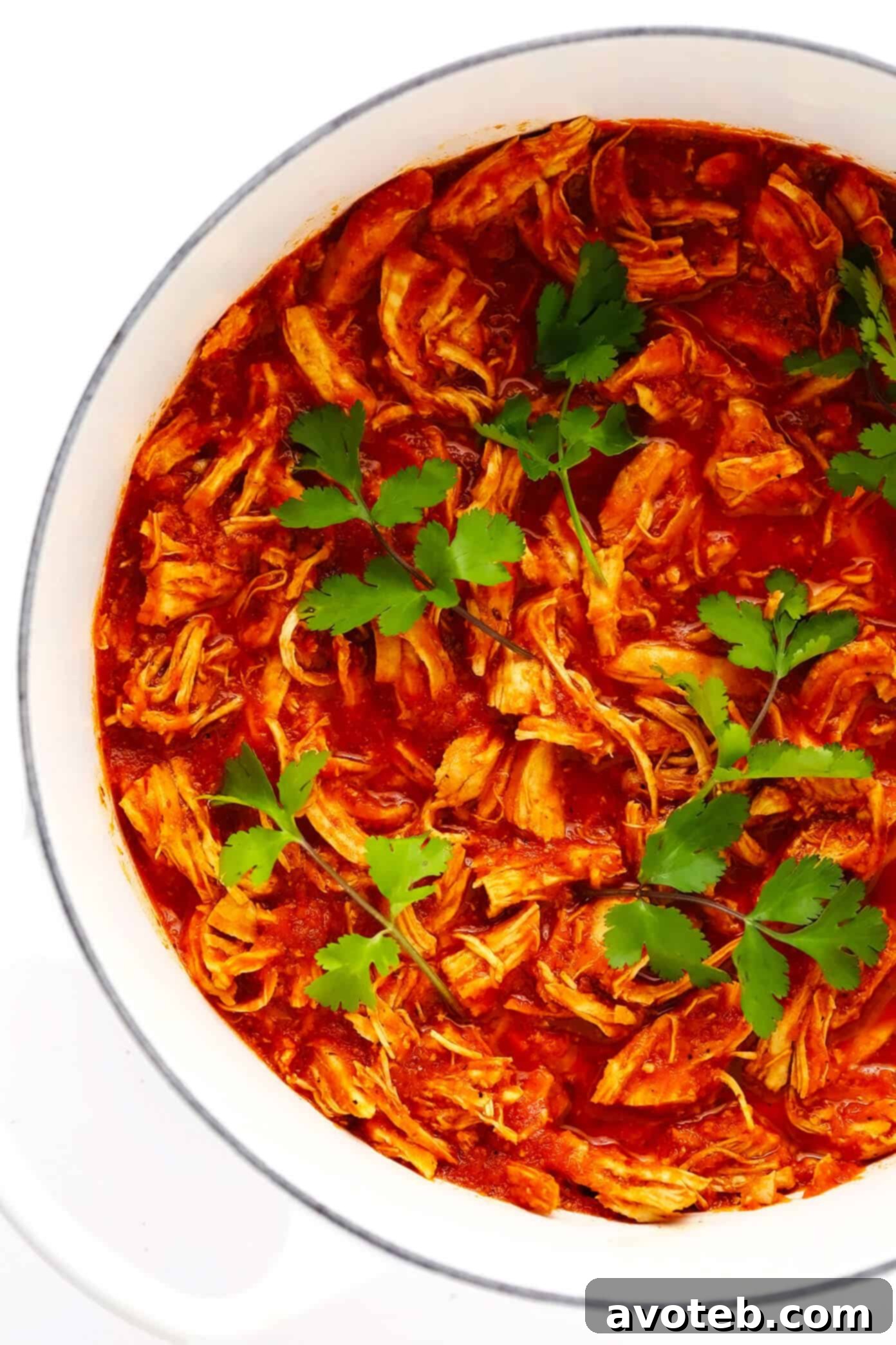 Easy Chicken Tinga cooking in a large stockpot on the stovetop