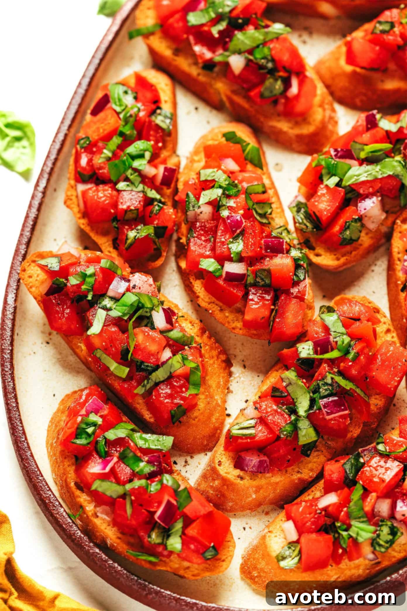 A vibrant platter of classic tomato bruschetta with fresh basil