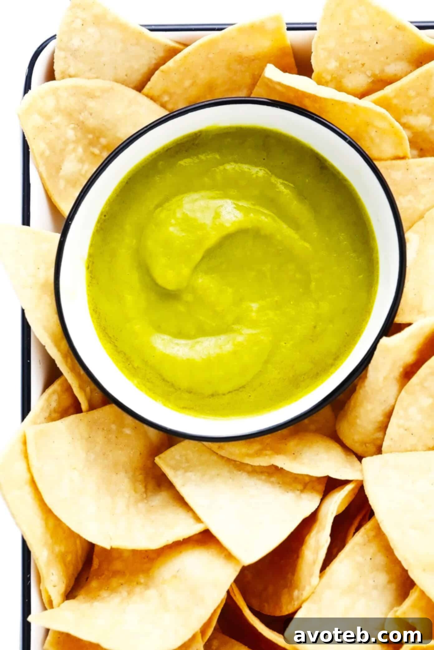 This 5-ingredient creamy jalapeño salsa recipe is easy to make in 30 minutes and irresistibly garlicky and flavorful. Perfect for dipping with chips or drizzling on whatever other Mexican-inspired dishes you love best. It is naturally gluten-free and vegan, and options are included to make this salsa as mild or spicy as you prefer. | gimmesomeoven.com Copycat Salsa Doña Recipe with Tortilla Chips, a creamy and flavorful dip