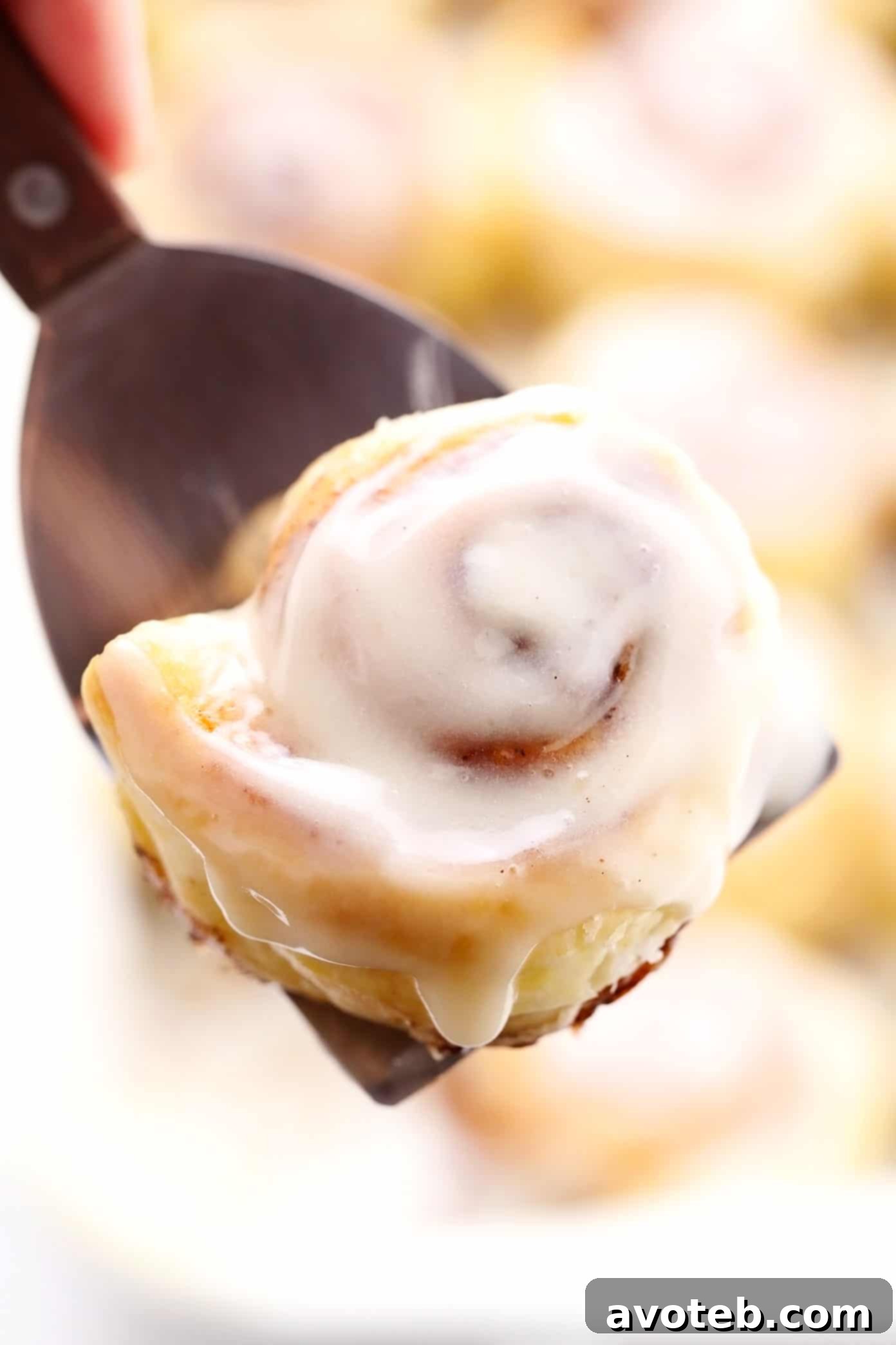 Enjoying a Freshly Baked Puff Pastry Cinnamon Bun