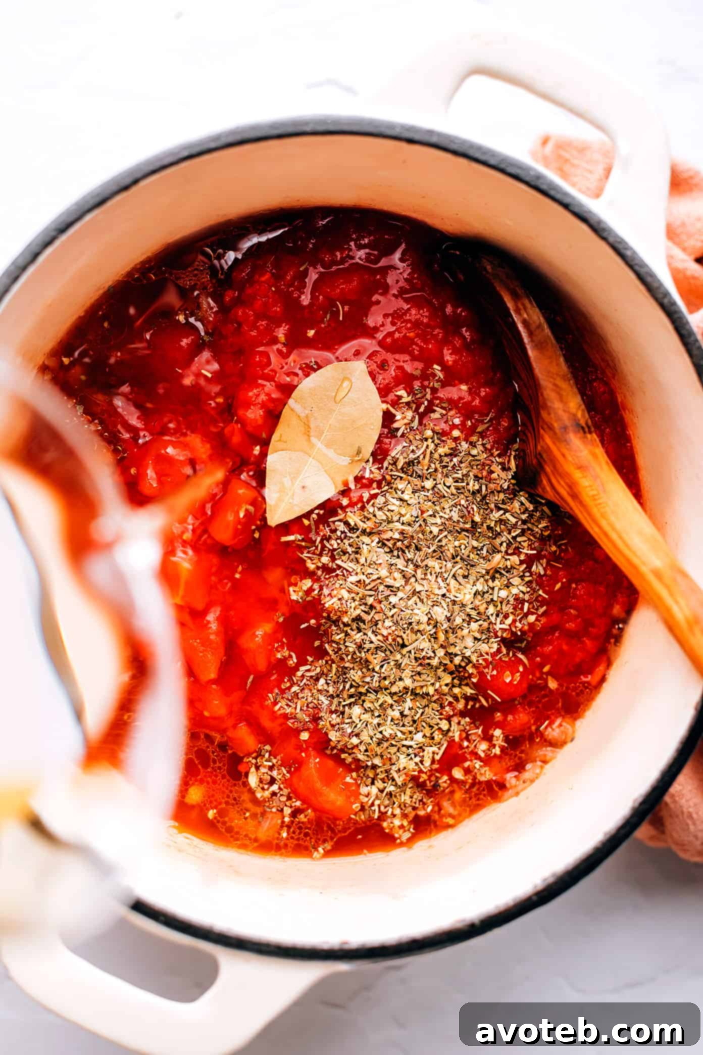 This easy lasagna soup recipe is made with Italian sausage (traditional or plant-based), a garlicky tomato herb broth, your choice of pasta, and three types of cheese (hello, mozzarella, ricotta AND Parmesan). Easy to make vegetarian, vegan and/or gluten-free if you'd like. And always such a cozy Italian 30-minute dinner recipe! | gimmesomeoven.com Sautéing aromatics for the lasagna soup broth