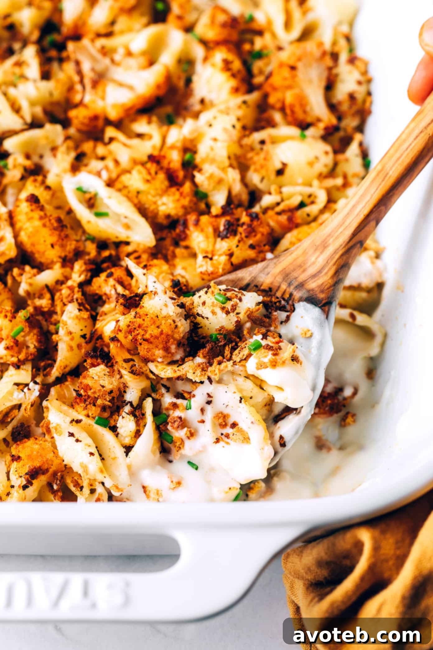 Closeup of roasted cauliflower macaroni and cheese in pan