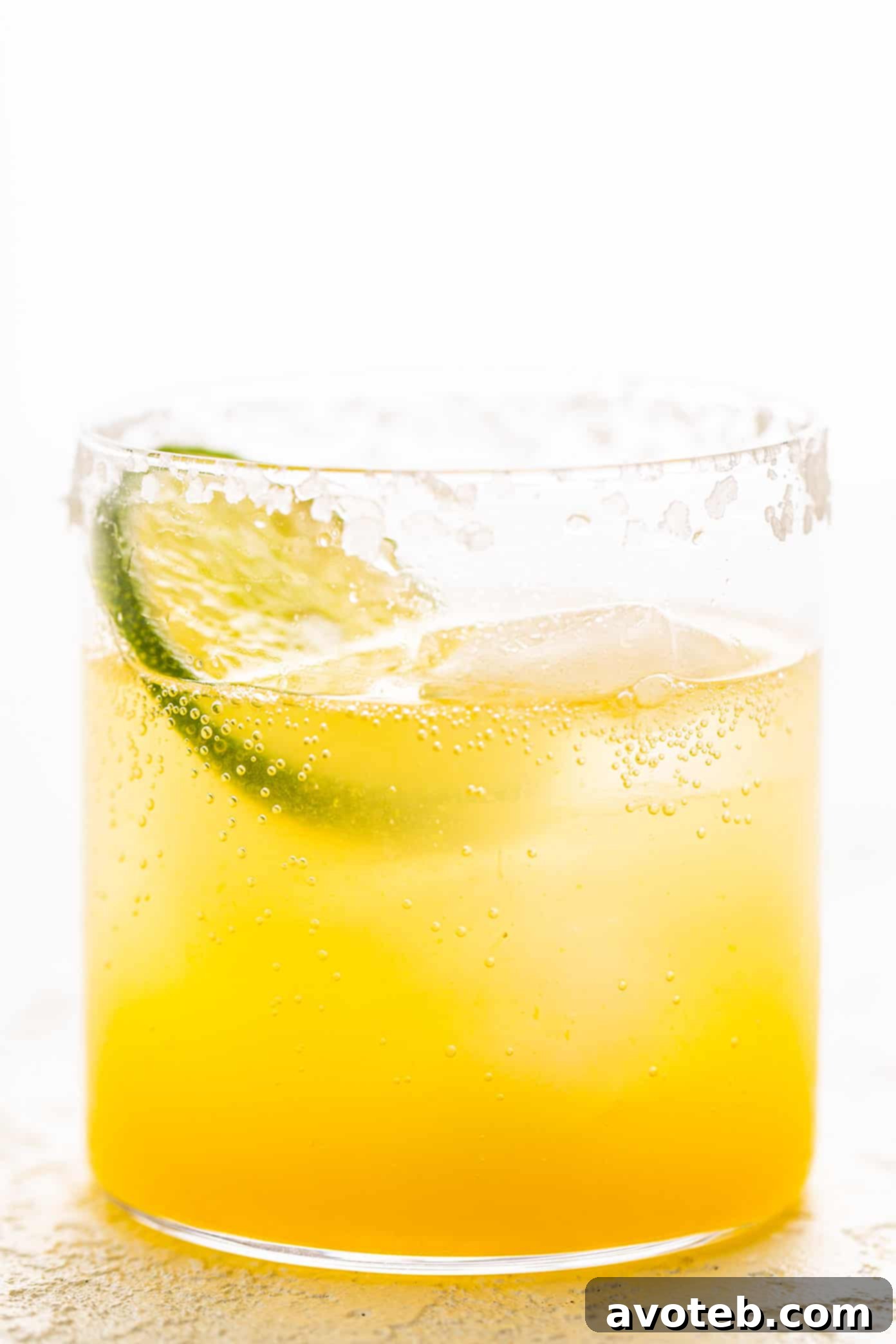 This virgin margarita mocktail recipe is quick and easy to make without alcohol, yet it's still so tangy, refreshing and delicious. Perfect to serve with your favorite Mexican food...or anytime you're craving a great mocktail! Virgin Margarita Mocktail