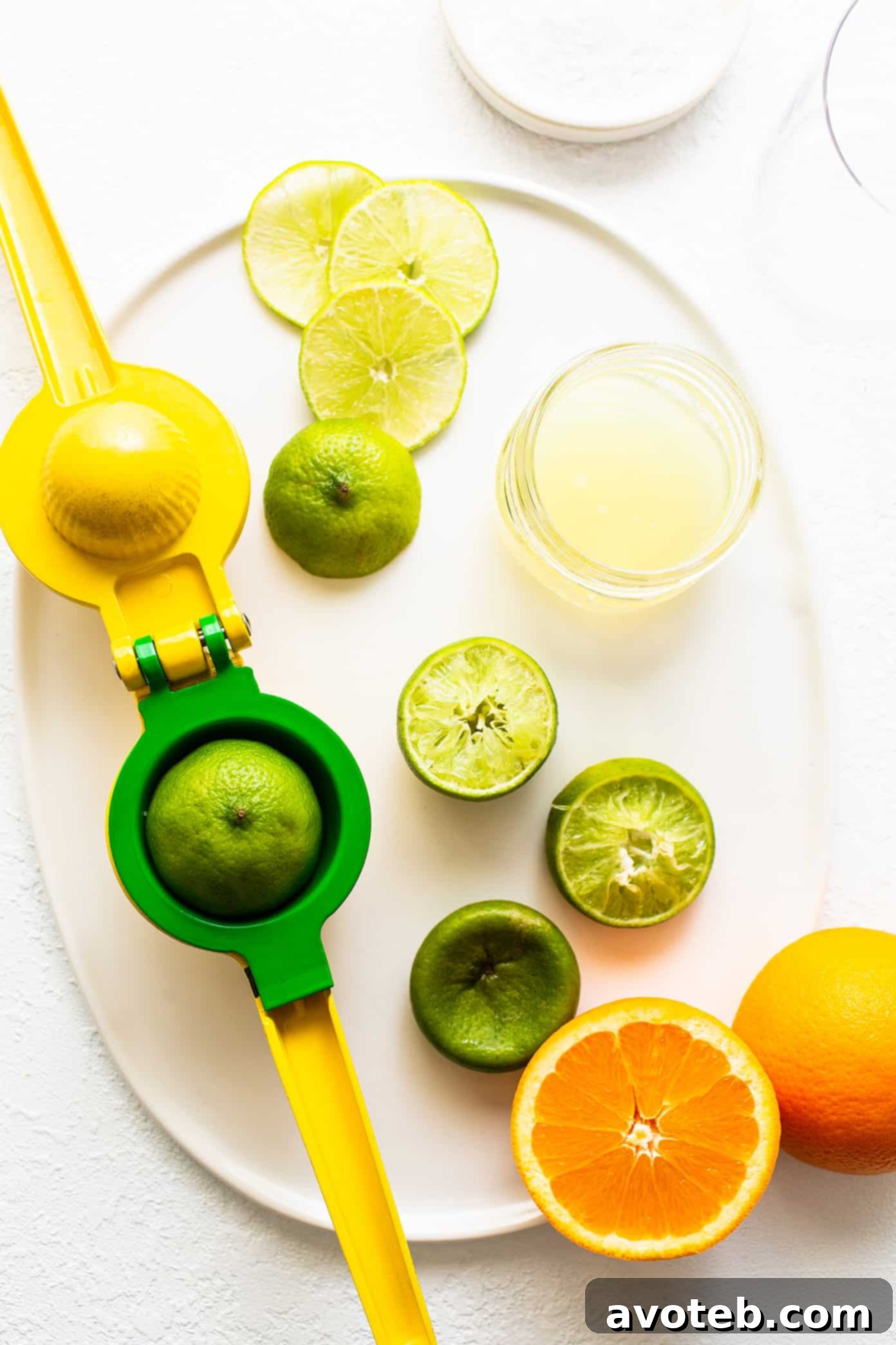 This virgin margarita mocktail recipe is quick and easy to make without alcohol, yet it's still so tangy, refreshing and delicious. Perfect to serve with your favorite Mexican food...or anytime you're craving a great mocktail! Virgin Margarita Ingredients on Plate