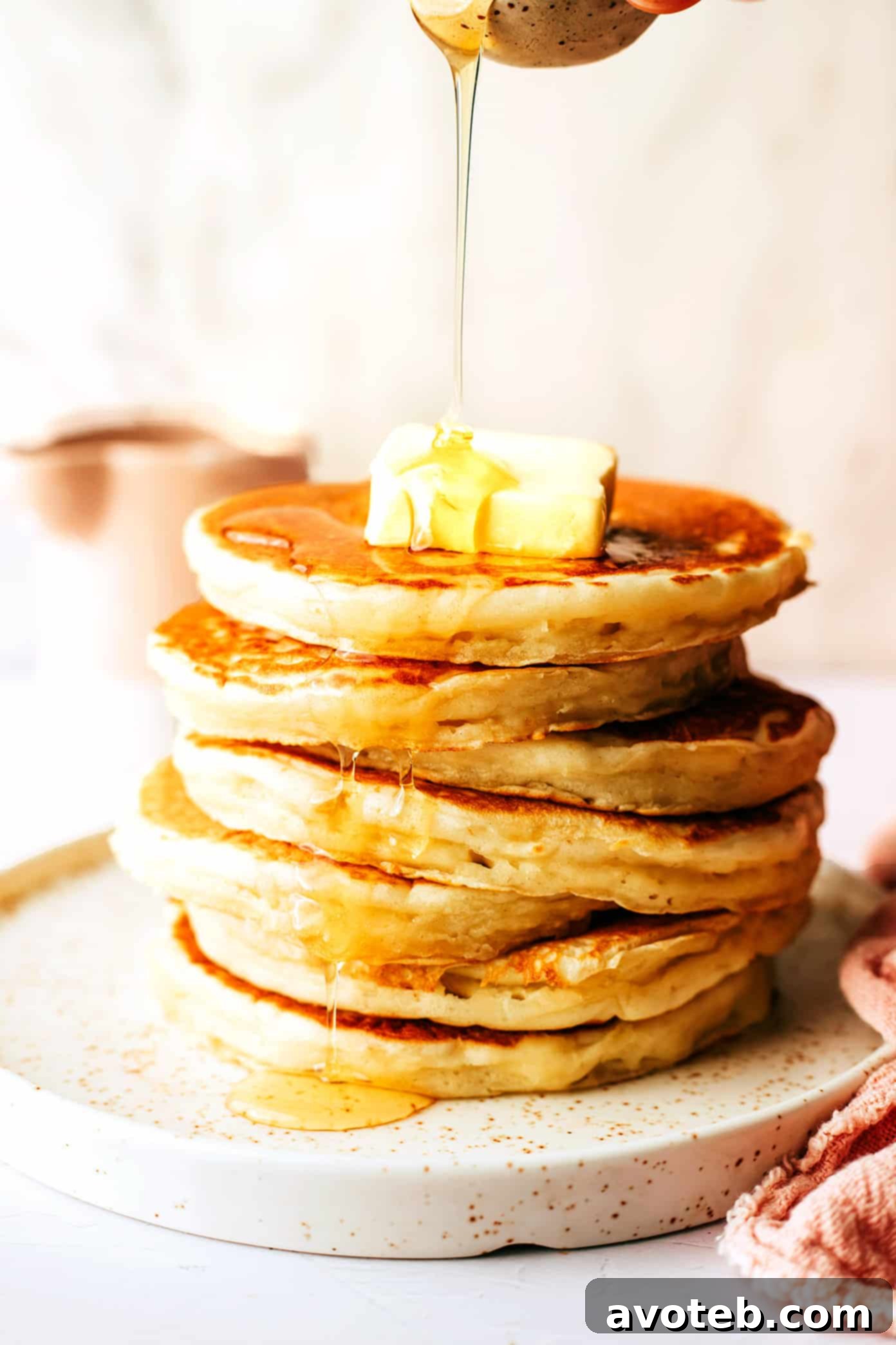 Fluffy Kefir Pancakes from Barclay 7 A vibrant display of various pancake toppings including fresh fruits, syrups, and whipped cream, inviting customization for a perfect breakfast.