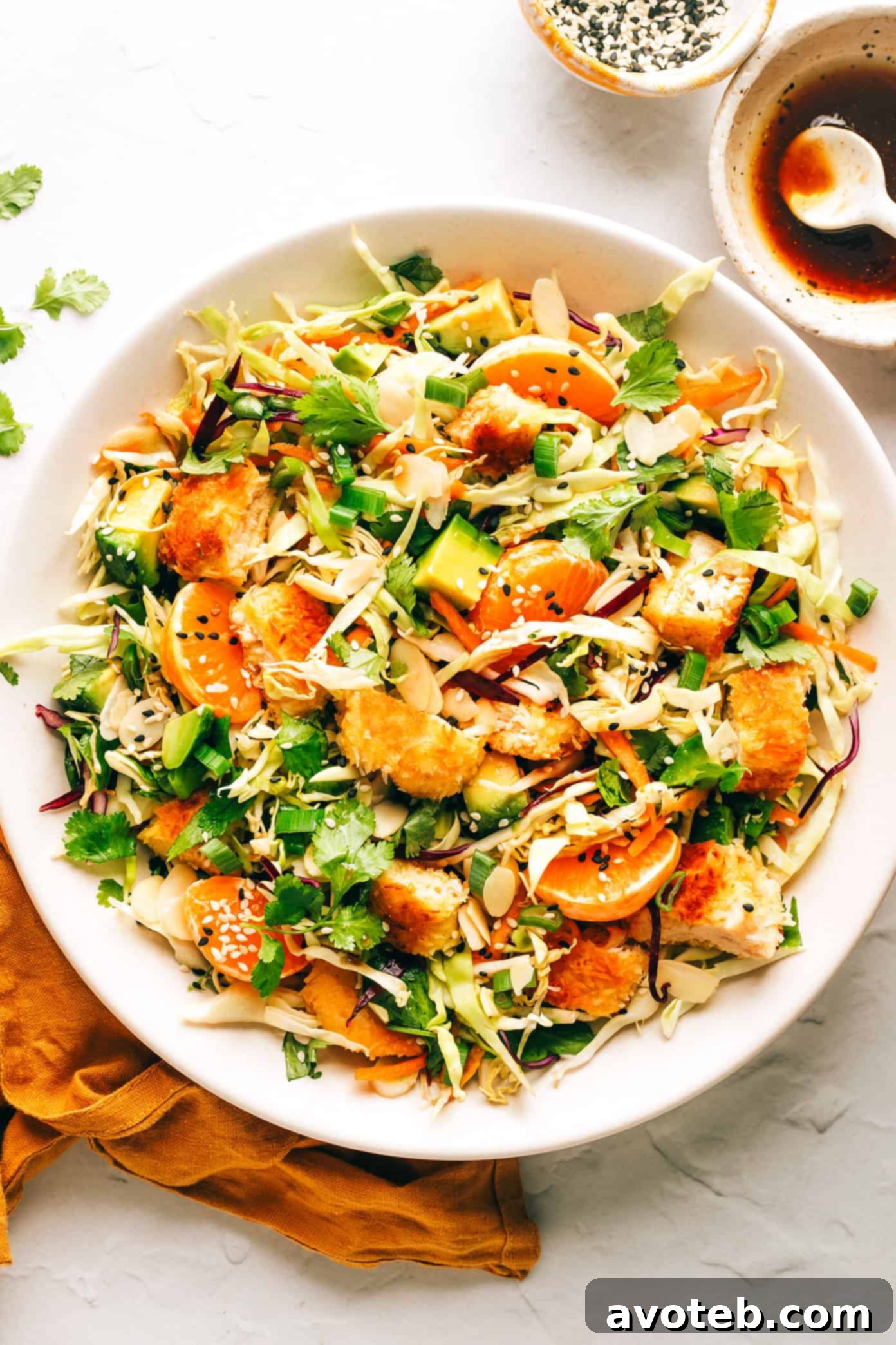 Crispy Coconut Chicken Salad arranged on plates