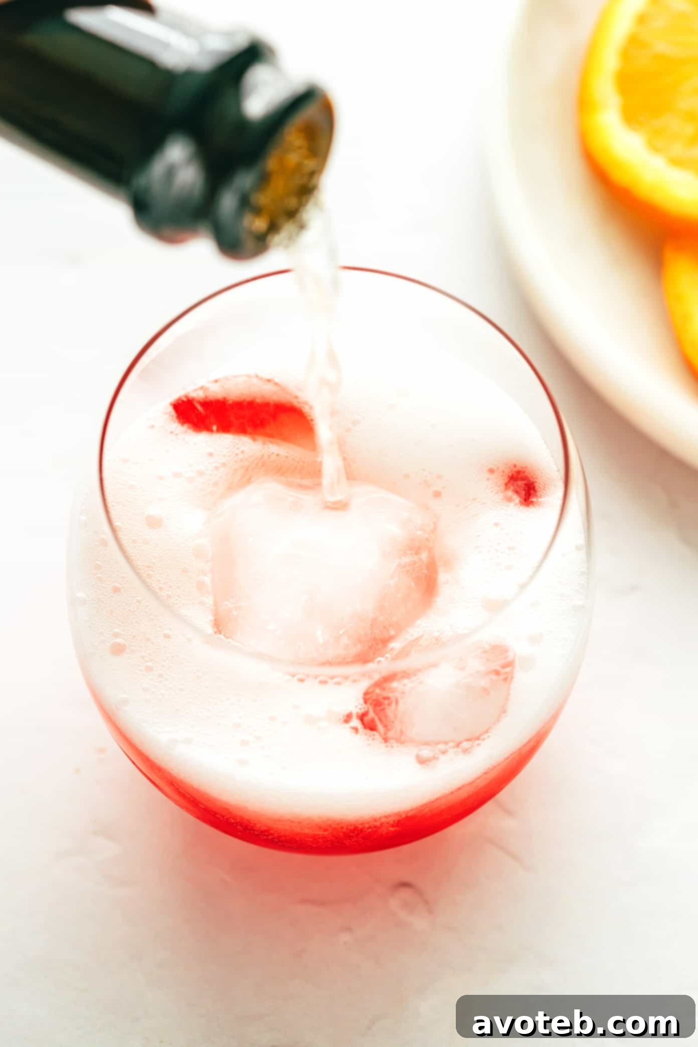 Close-up of Campari Spritz cocktail with ice and orange