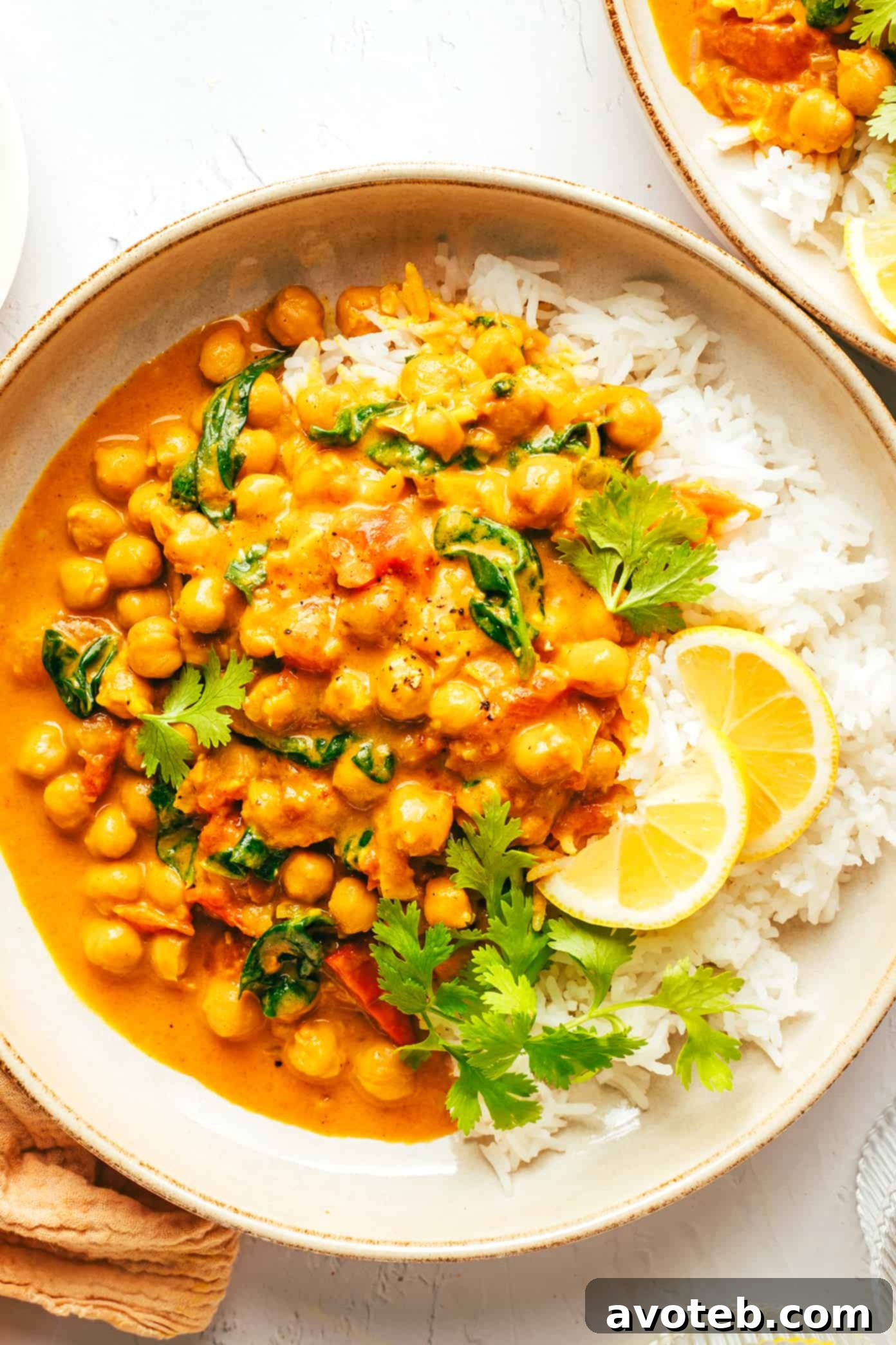 Easy Chickpea Curry with Rice and Lemons in Serving Bowls