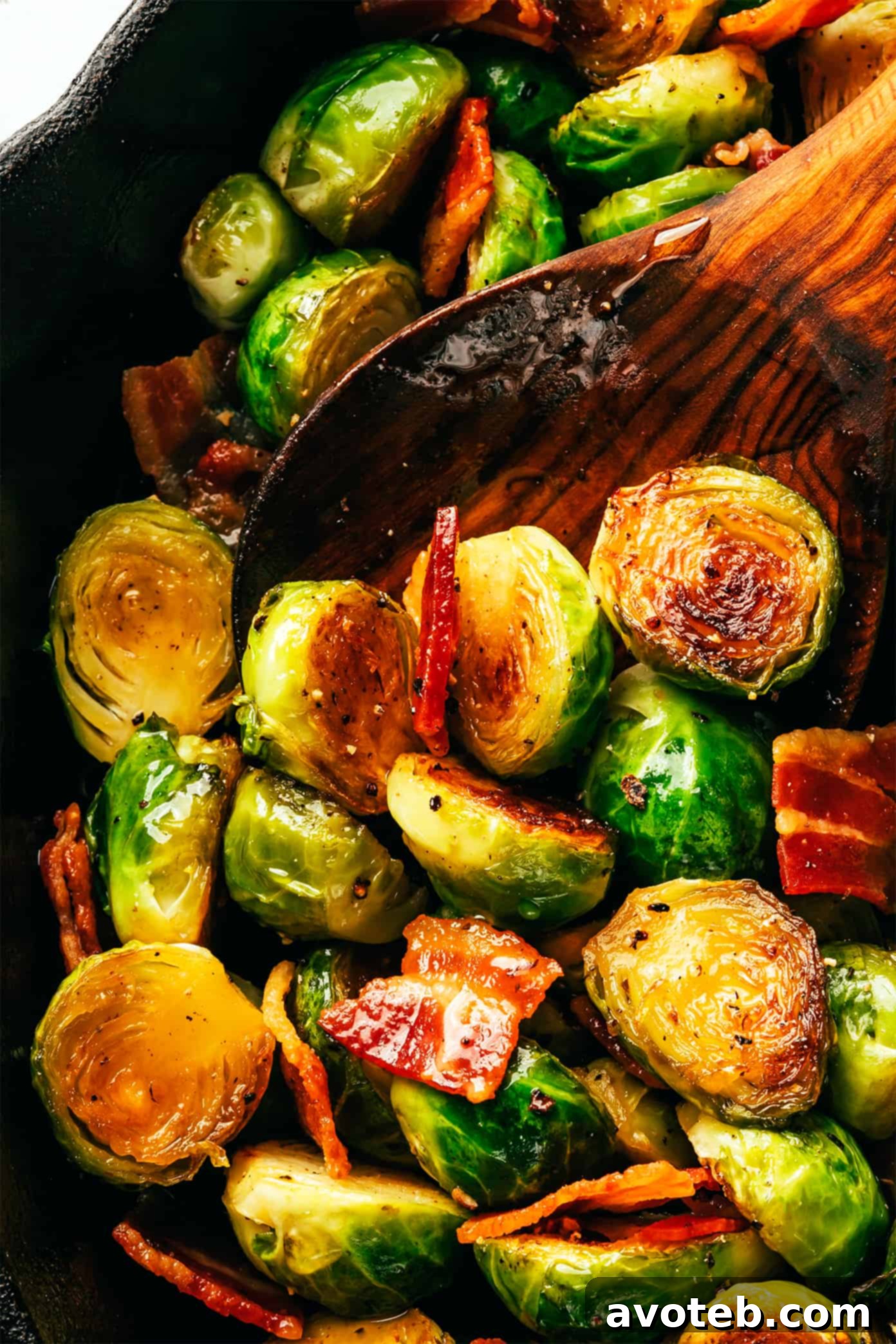 These bacon Brussels sprouts are easy to make and tossed with an irresistible drizzle of hot honey. The perfect side dish for Thanksgiving, dinner parties, or anytime you're just craving some extra-delicious vegetables. Bacon Brussels Sprouts Closeup