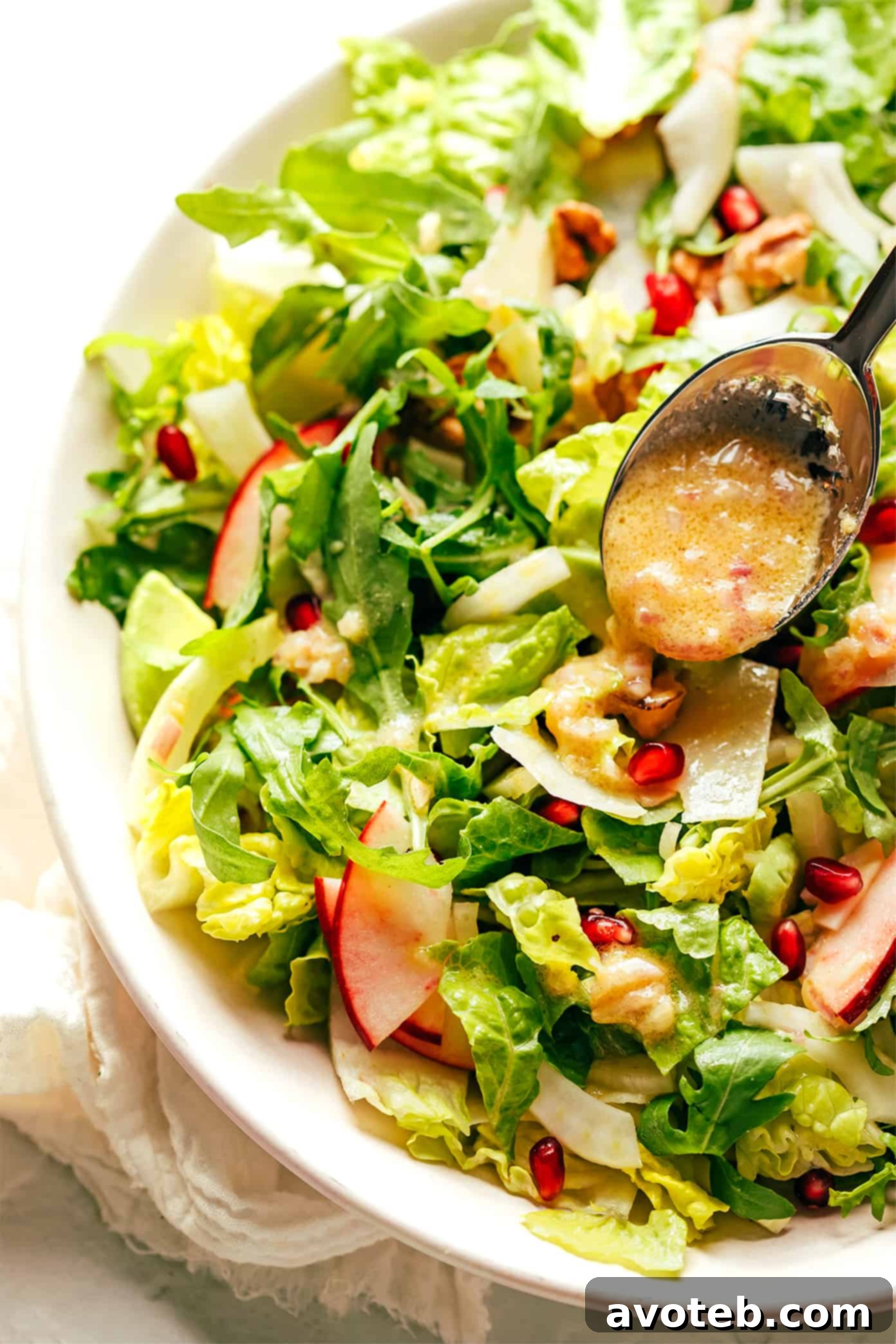 The exquisite shallot vinaigrette brings together the vibrant flavors of pomegranate, apple, fennel, and greens in this festive holiday salad. Drizzling homemade shallot vinaigrette over the vibrant pomegranate green salad