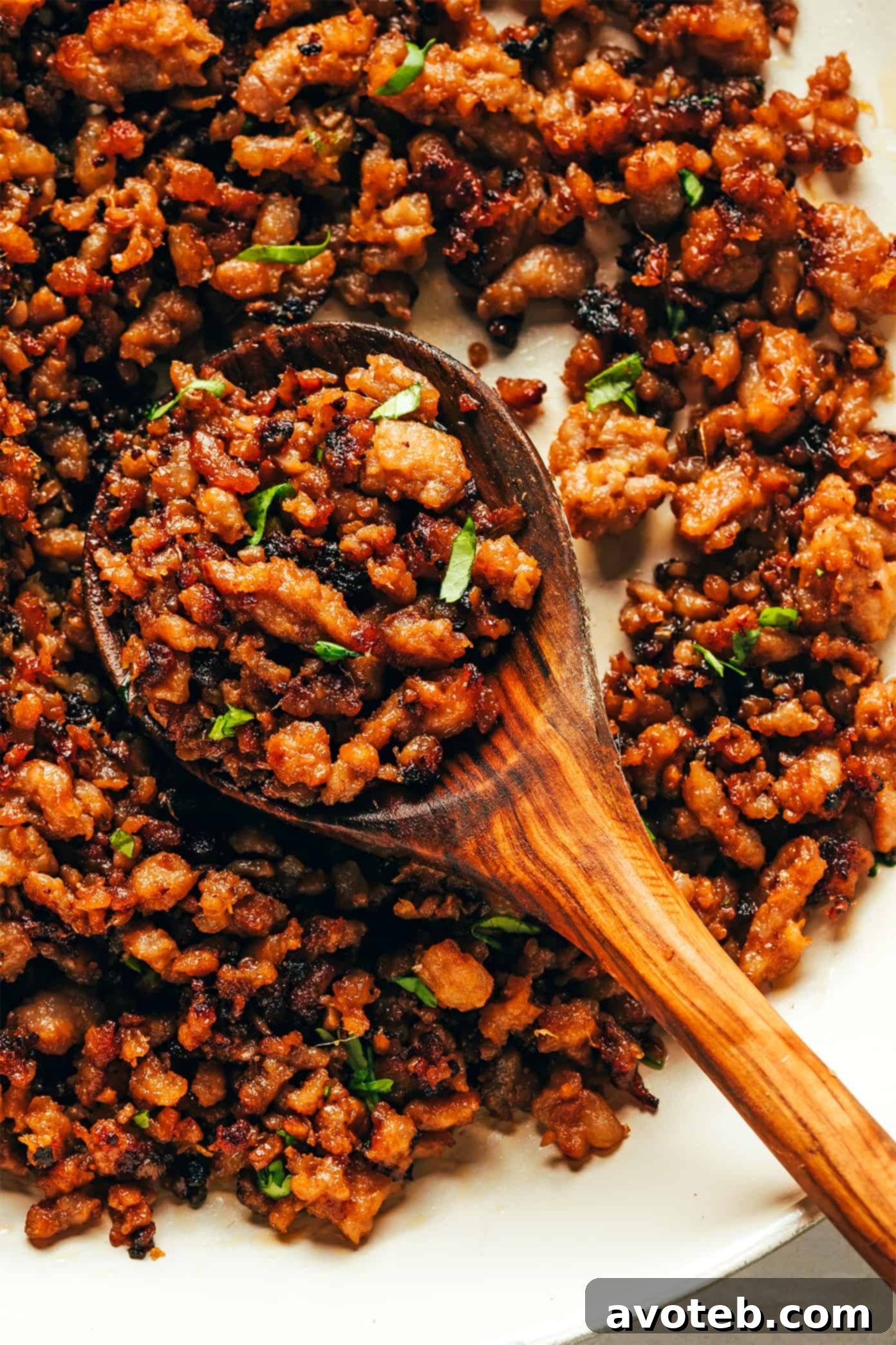 Irresistibly Caramelized Ginger Lime Pork Close-up of perfectly caramelized ground pork in a skillet, coated in a glossy ginger-lime sauce