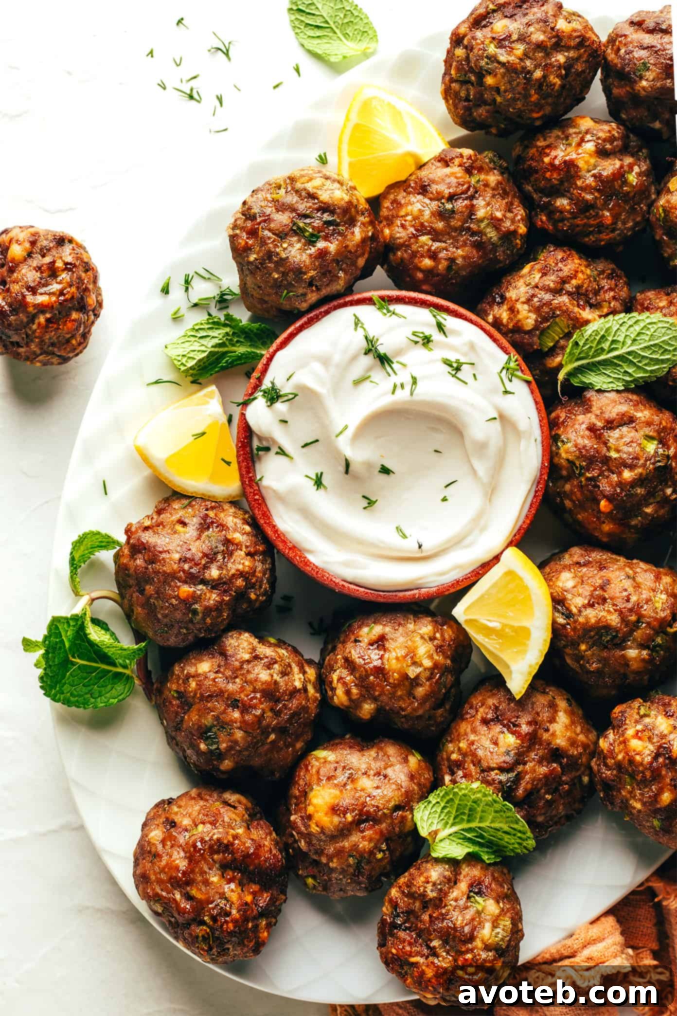 A tray of perfectly formed Greek Meatballs ready for baking