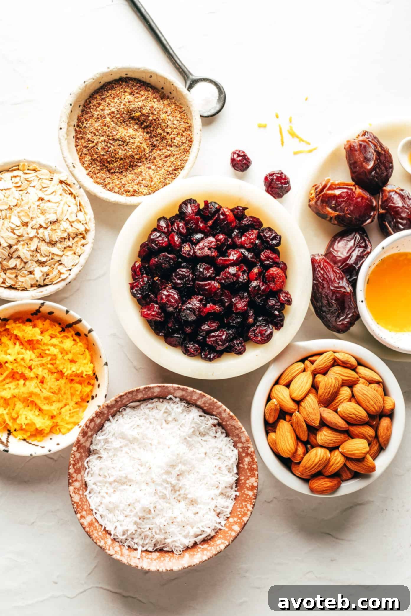 A close-up shot of the energy bite mixture in a food processor, highlighting the texture and ingredients before rolling.