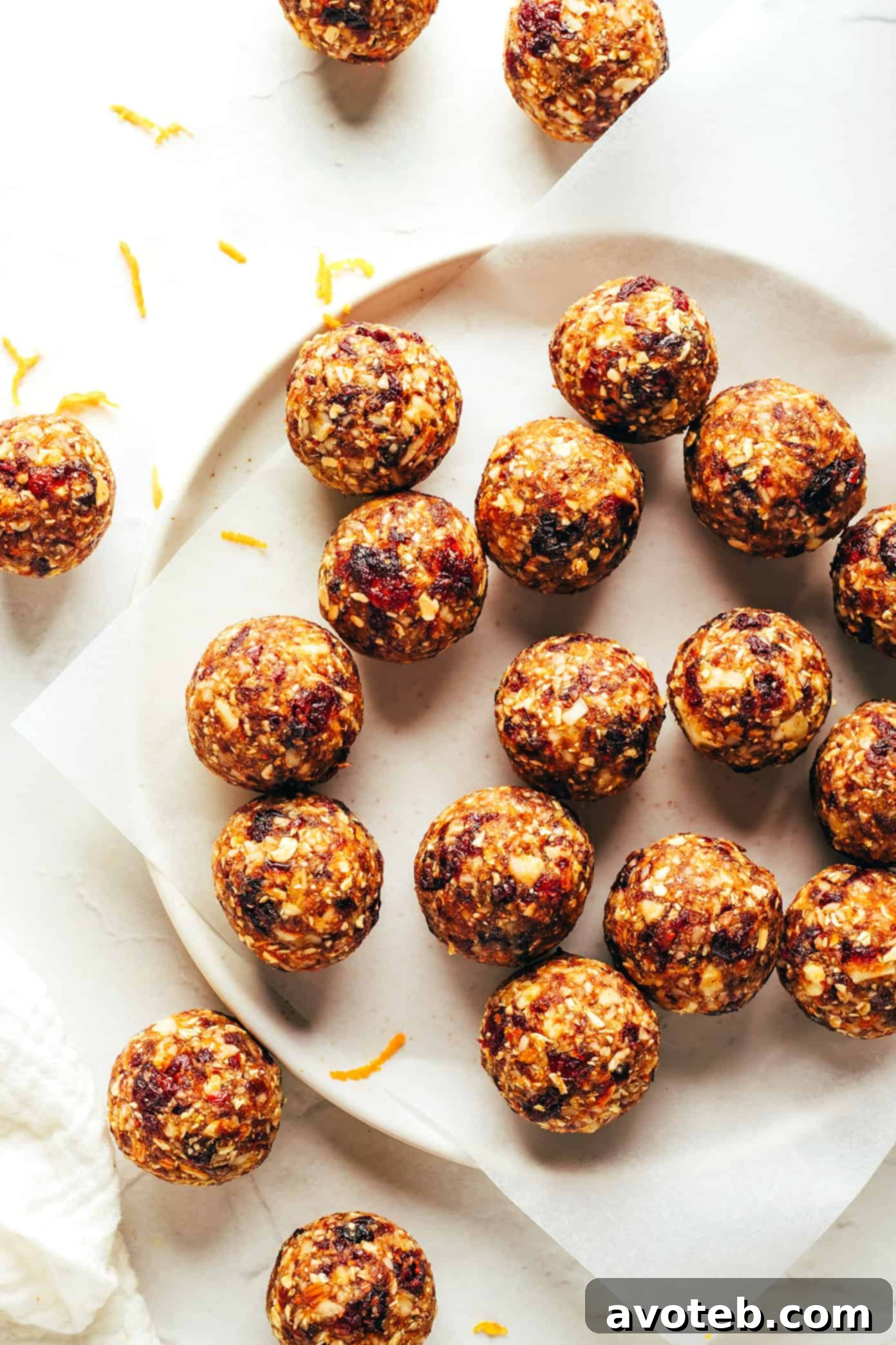 A large bowl filled with freshly made cranberry orange almond energy bites, ready to be enjoyed.