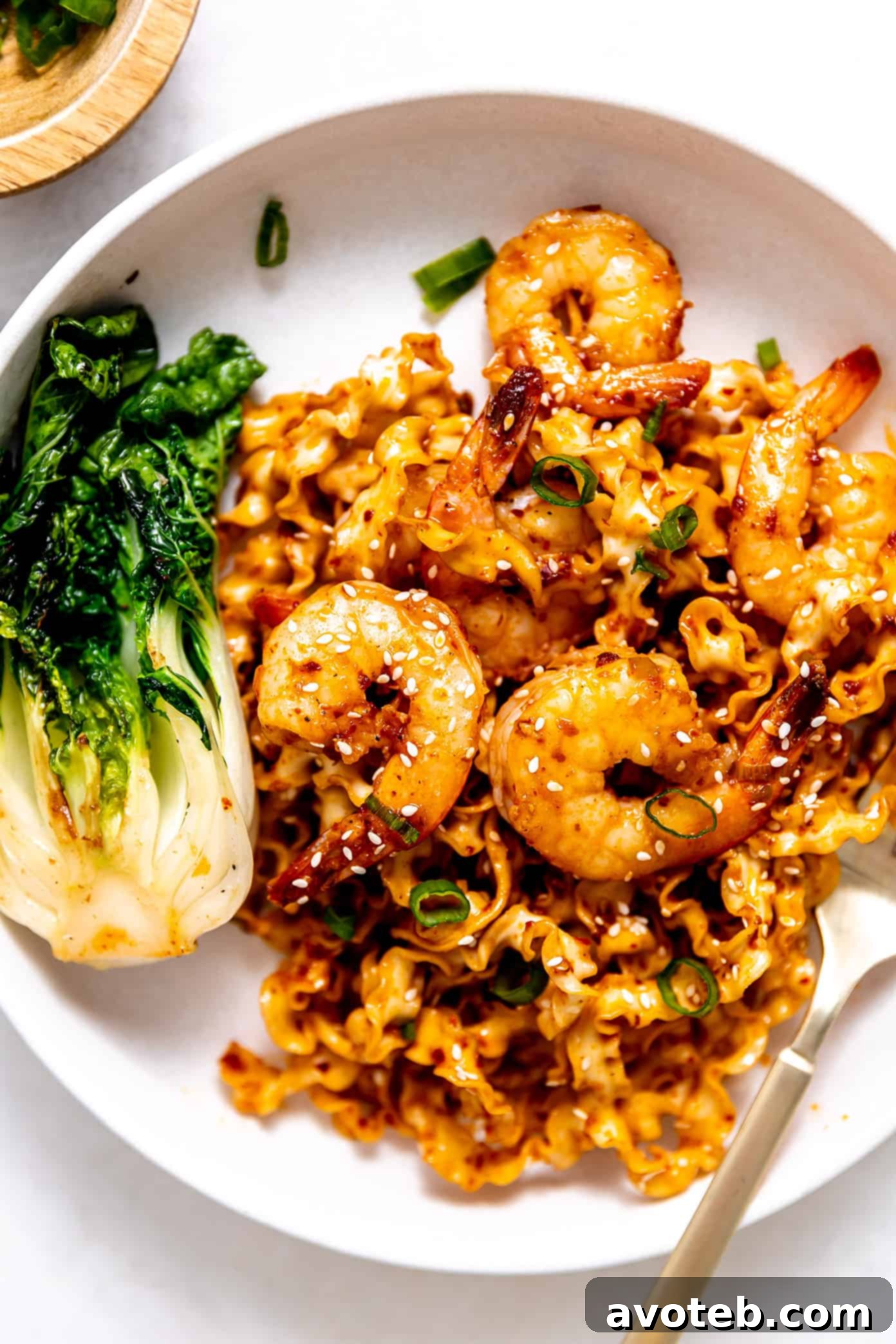 Garlic Chili Oil Noodles with Shrimp and Bok Choy served on a plate