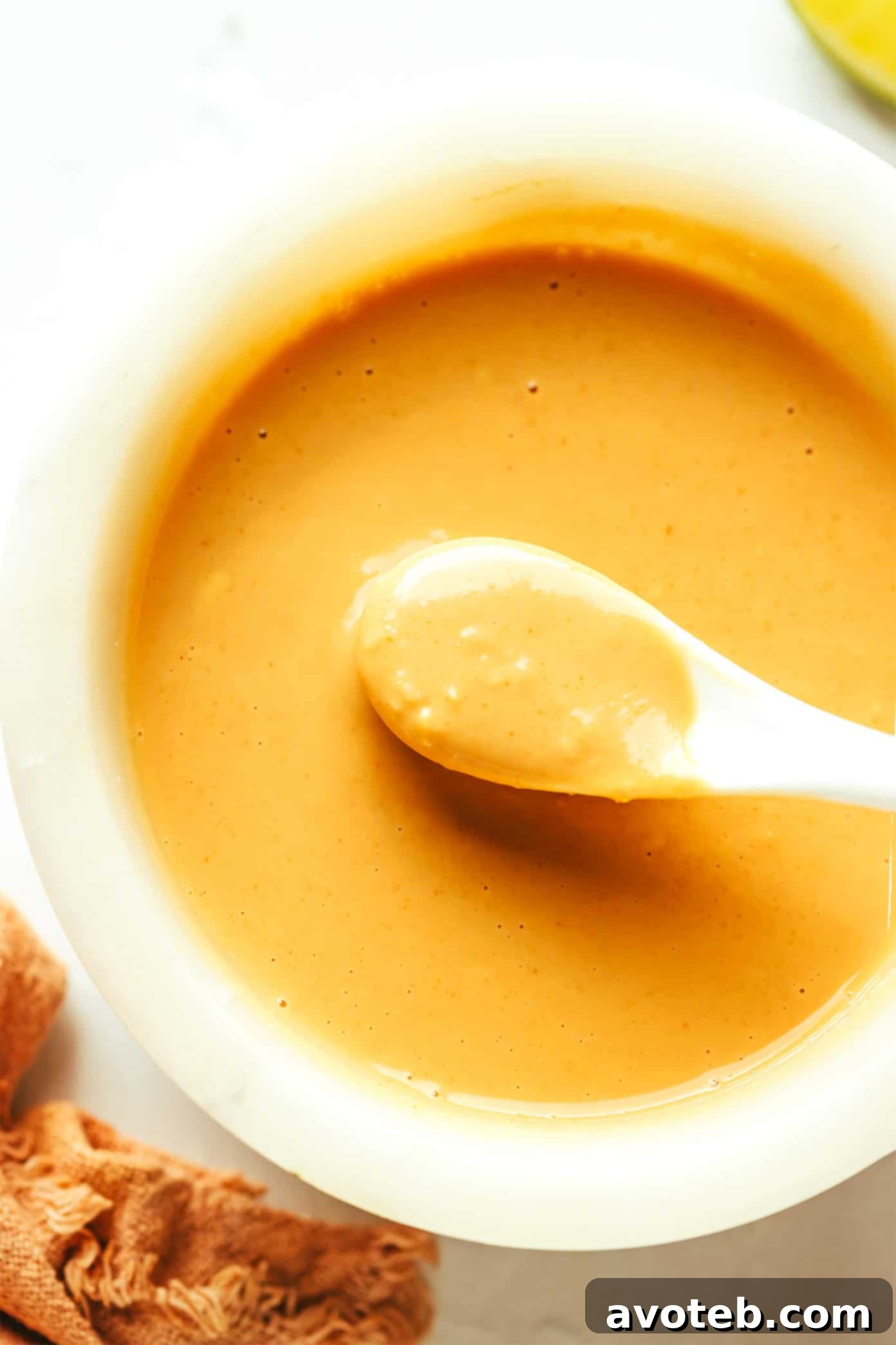 Creamy Peanut Dressing in a bowl with a spoon