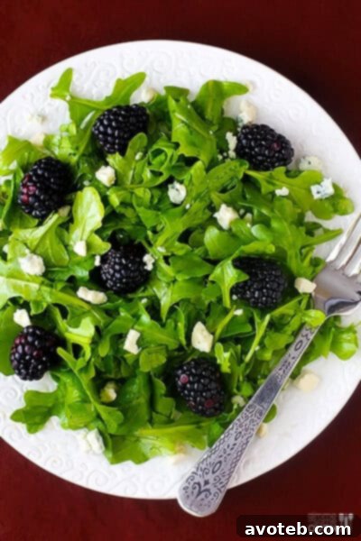 Close-up of a fresh Easy Blackberry Arugula Salad, highlighting the vibrant colors and textures.