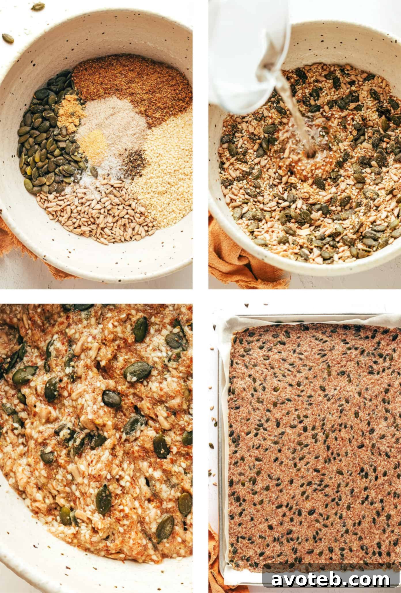 Unbaked seed cracker batter spread thinly on parchment paper on a baking sheet