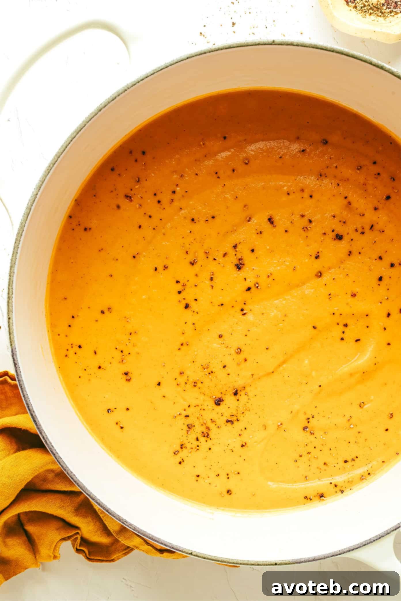 Creamy Roasted Vegetable Soup in a bowl with a spoon