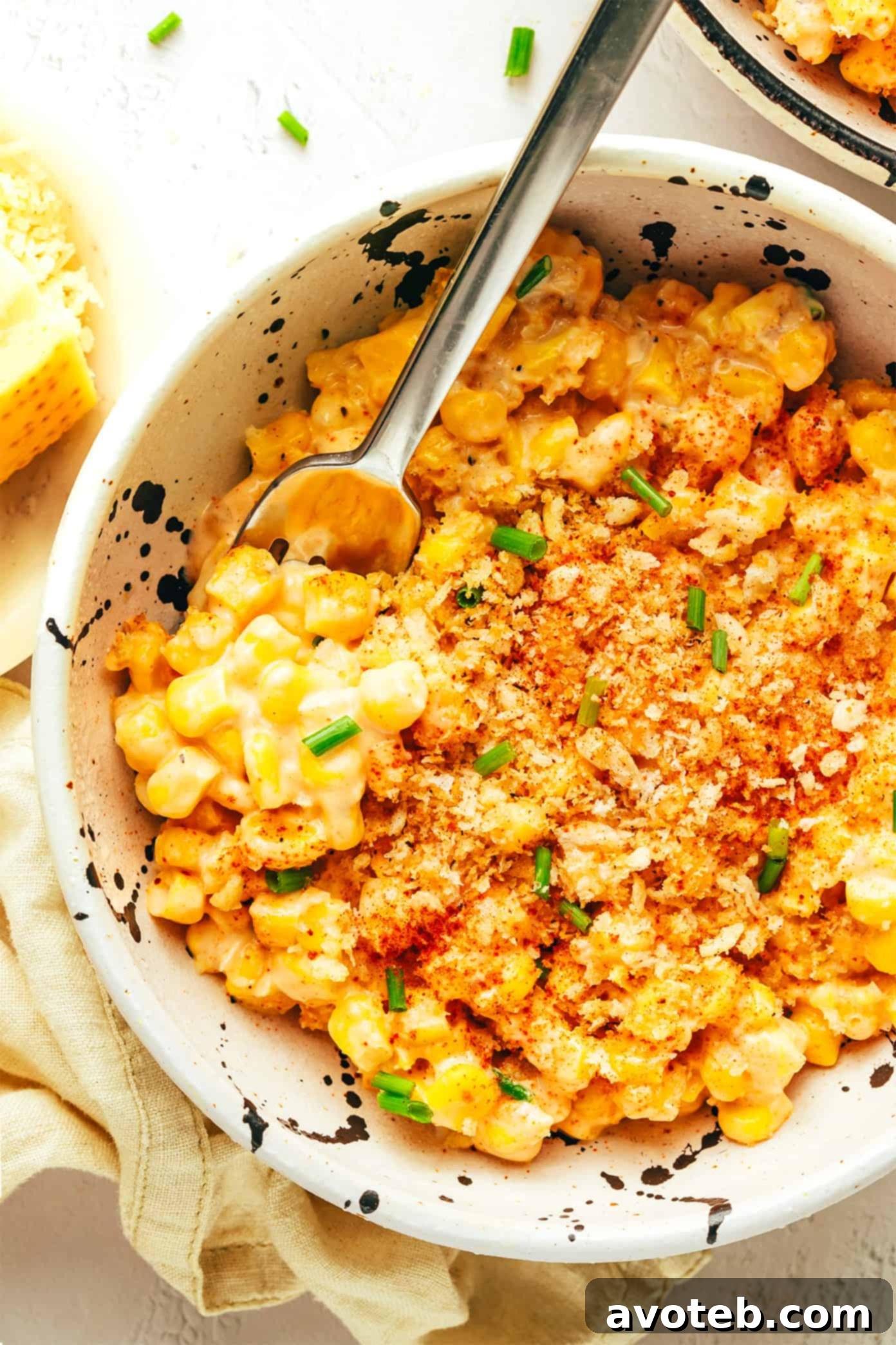 Parmesan Creamed Corn with crispy garlic breadcrumbs, a perfect side dish for holidays and weeknights.