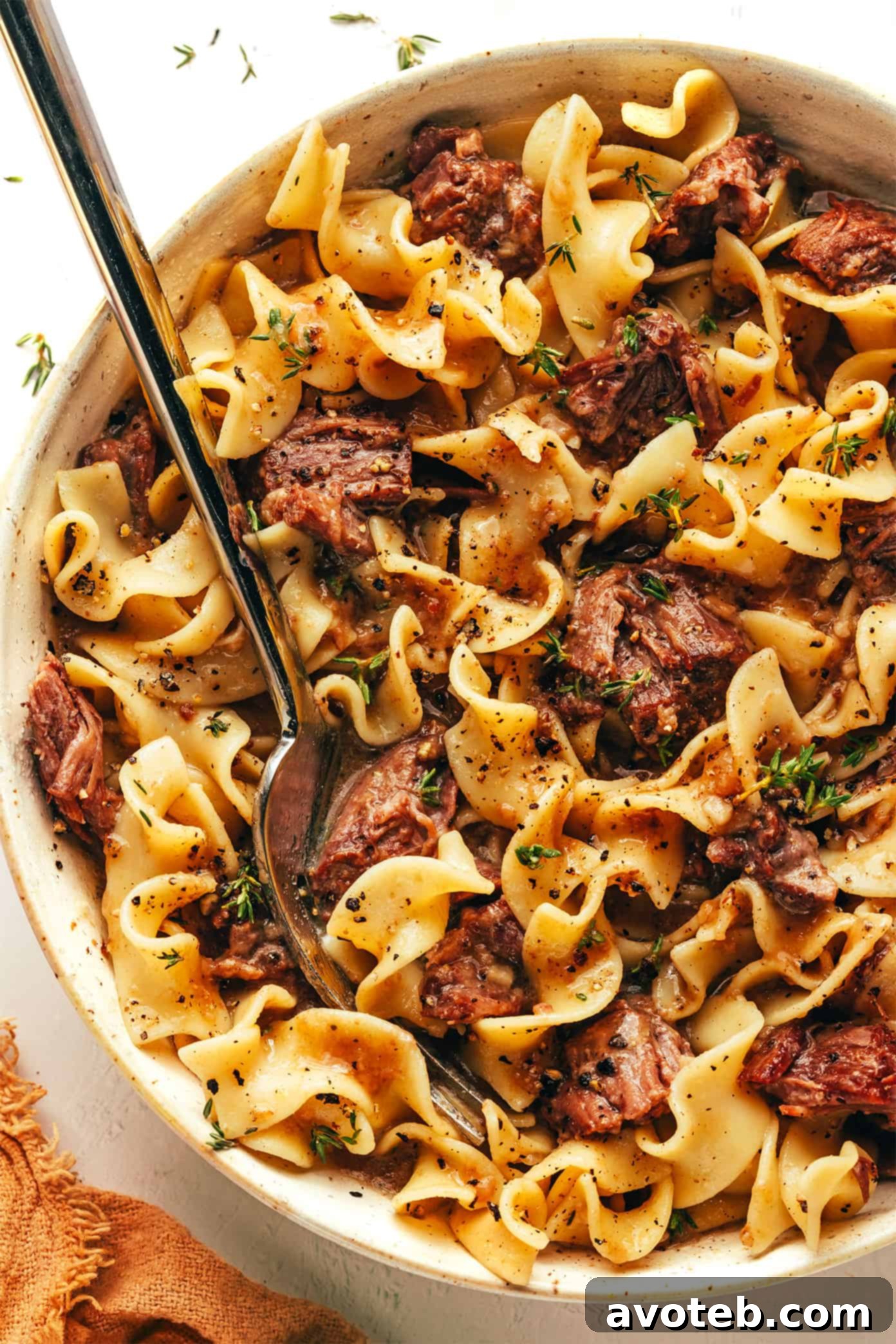 A close-up of the finished beef and noodles, highlighting the rich sauce and tender beef.