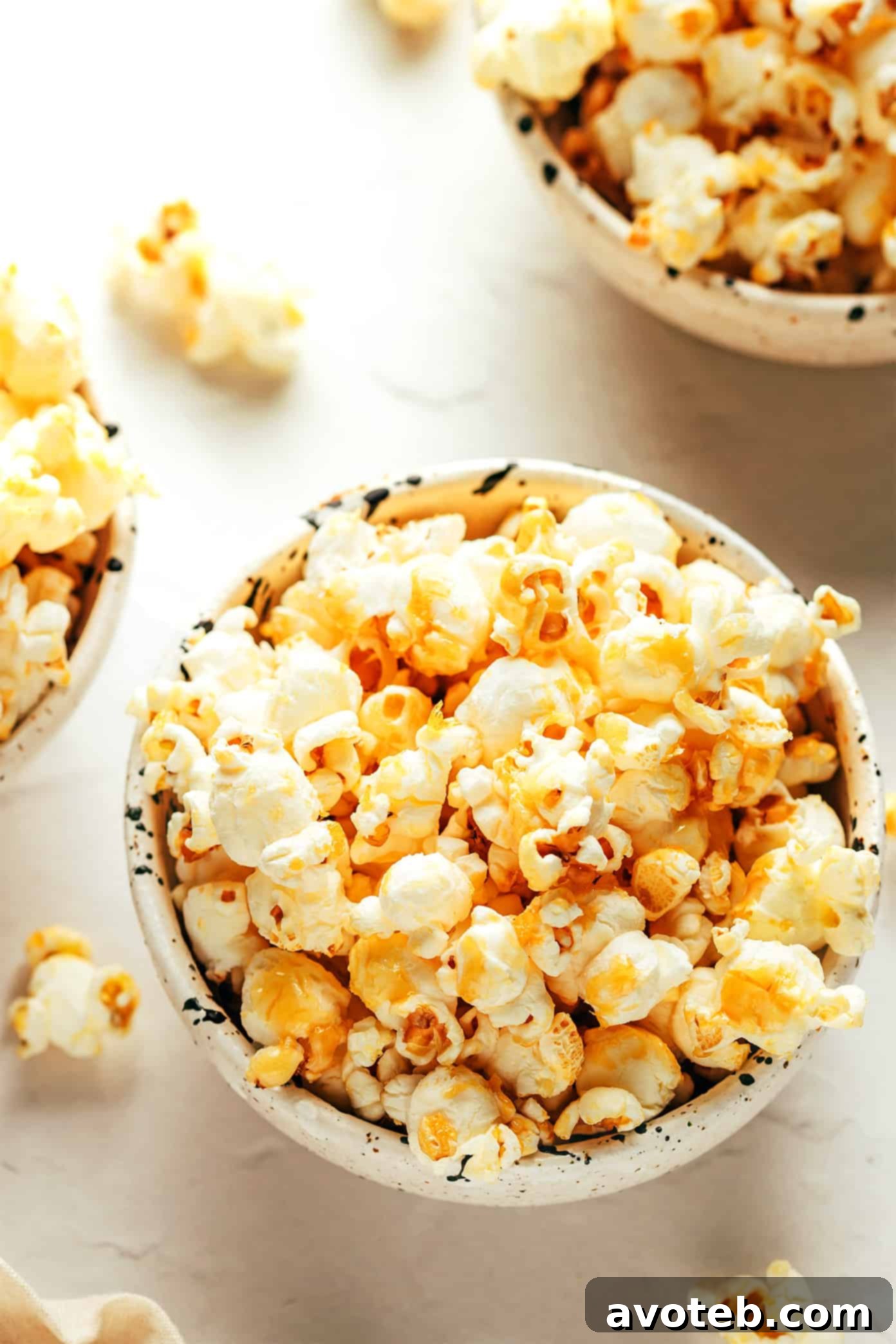 A final shot of a bowl of homemade kettle corn with a few unpopped kernels visible, ready to be enjoyed.