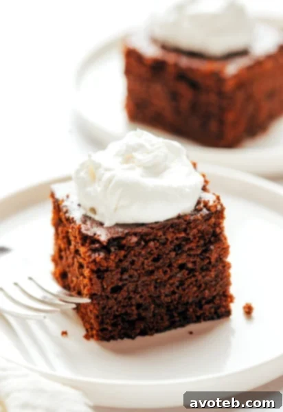 A beautifully baked gingerbread cake, sliced and ready for serving.