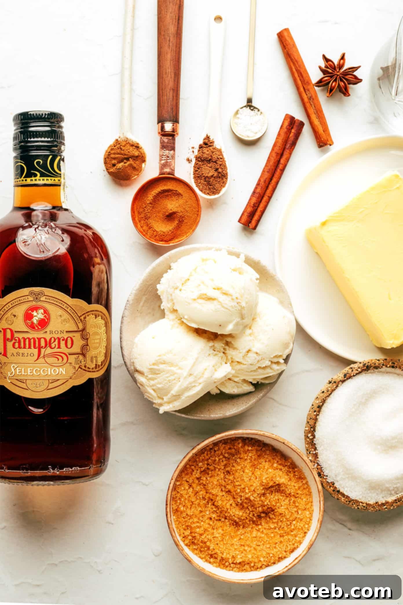 A second close-up image of hot buttered rum, emphasizing its rich texture and steam.