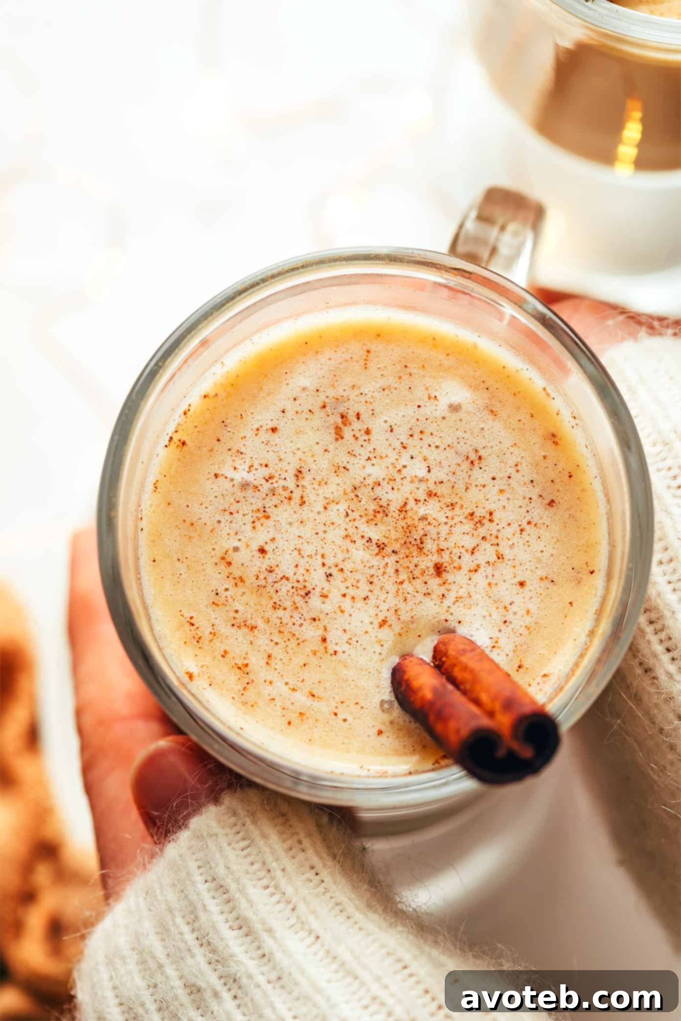 Hot buttered rum served in elegant mugs, garnished and ready to be enjoyed.
