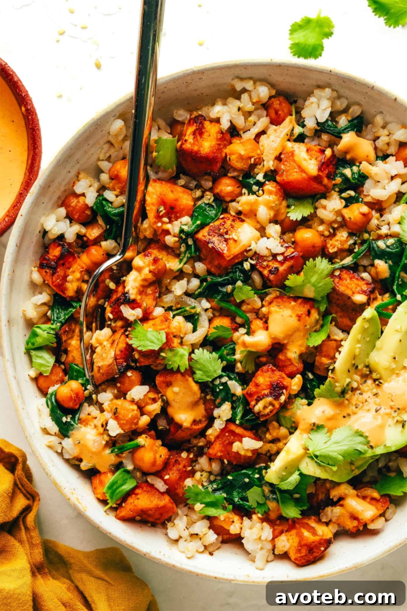 A final close-up of a perfectly constructed roasted sweet potato and chickpea bowl with all the elements.