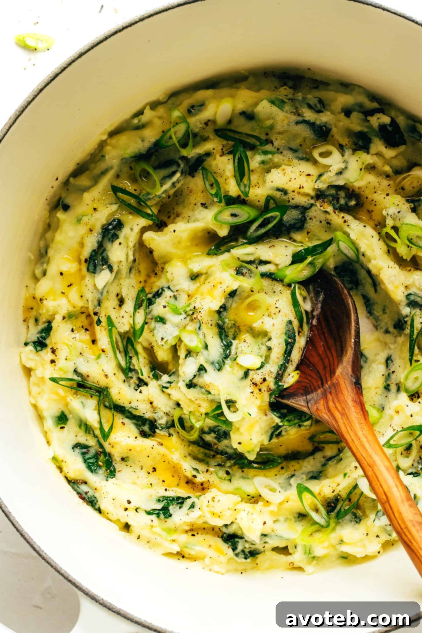 A delicious bowl of Irish Colcannon with melted butter and fresh scallions.