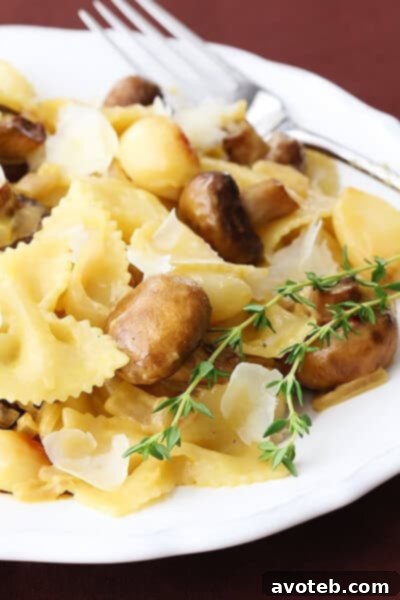 Creamy Roasted Garlic & Mushroom Pasta | gimmesomeoven.com Close-up shot of the Creamy Roasted Garlic & Mushroom Pasta, showcasing the creamy sauce and mushrooms.