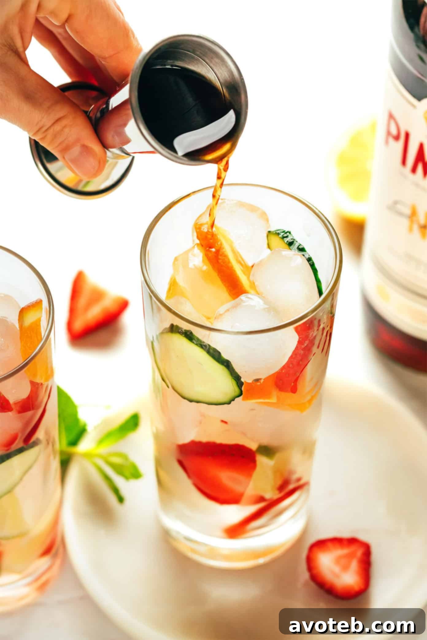 Close-up of fresh fruit and cucumber slices, key ingredients for a Pimm's Cup