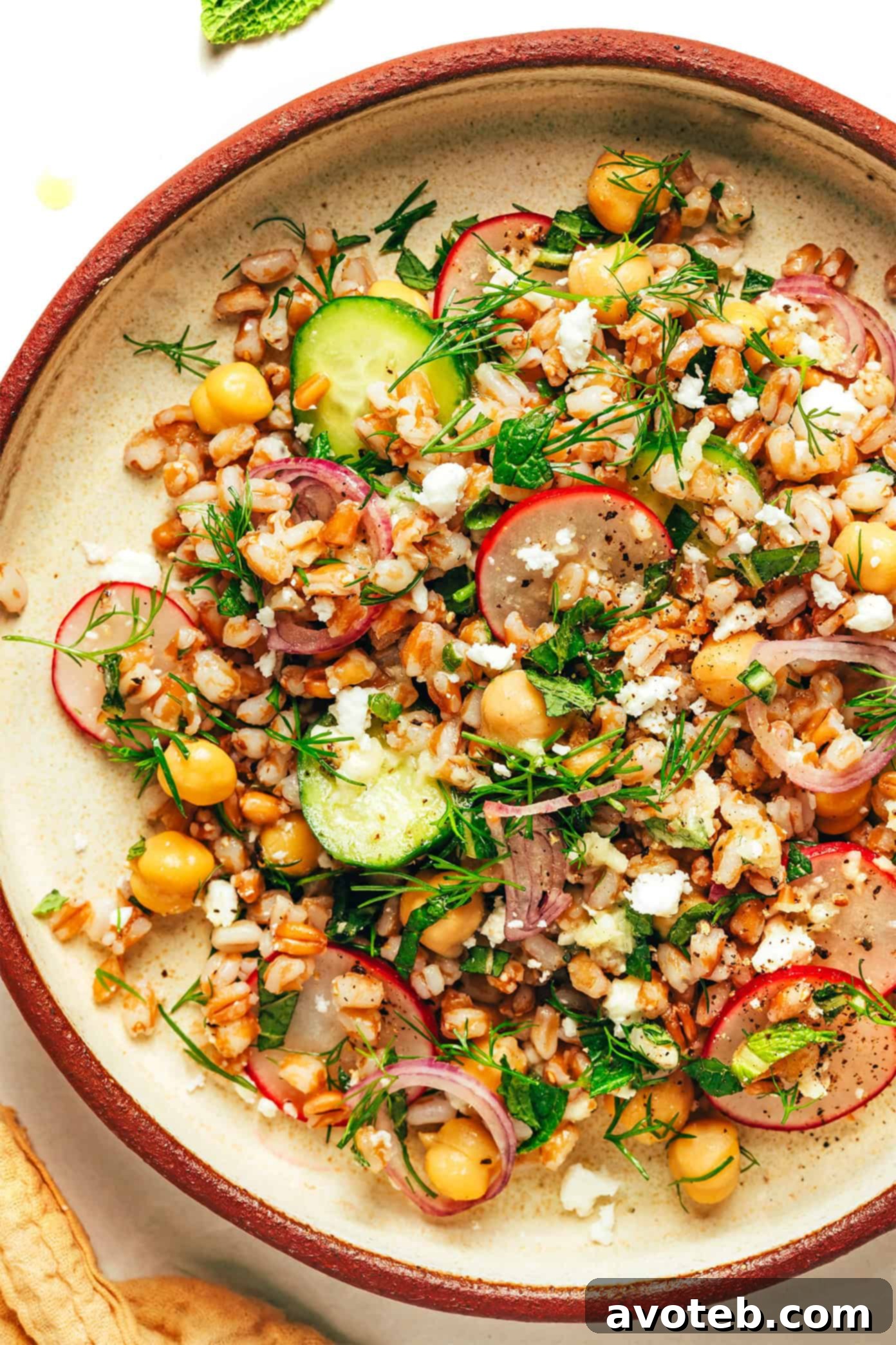 Vibrant Spring Farro Salad 6 A close-up, overhead shot of the prepared Spring Farro Salad, showcasing its colorful and fresh ingredients.