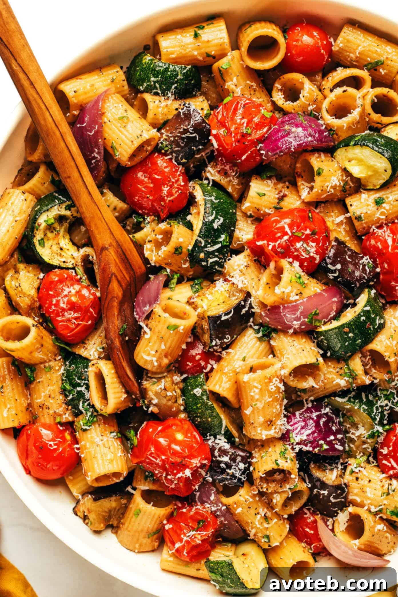 Rustic Roasted Vegetable Pasta 5 A large pan filled with roasted vegetable pasta, showing a mix of pasta, caramelized veggies, and sauce.